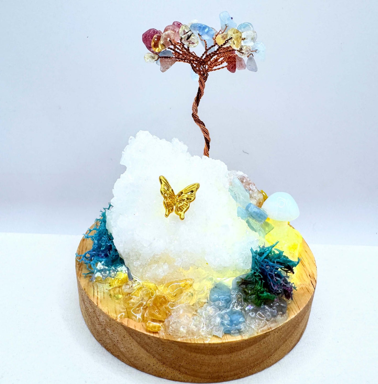 Crystal lamp featuring a handcrafted garden with crystals, moss, and a decorative butterfly.