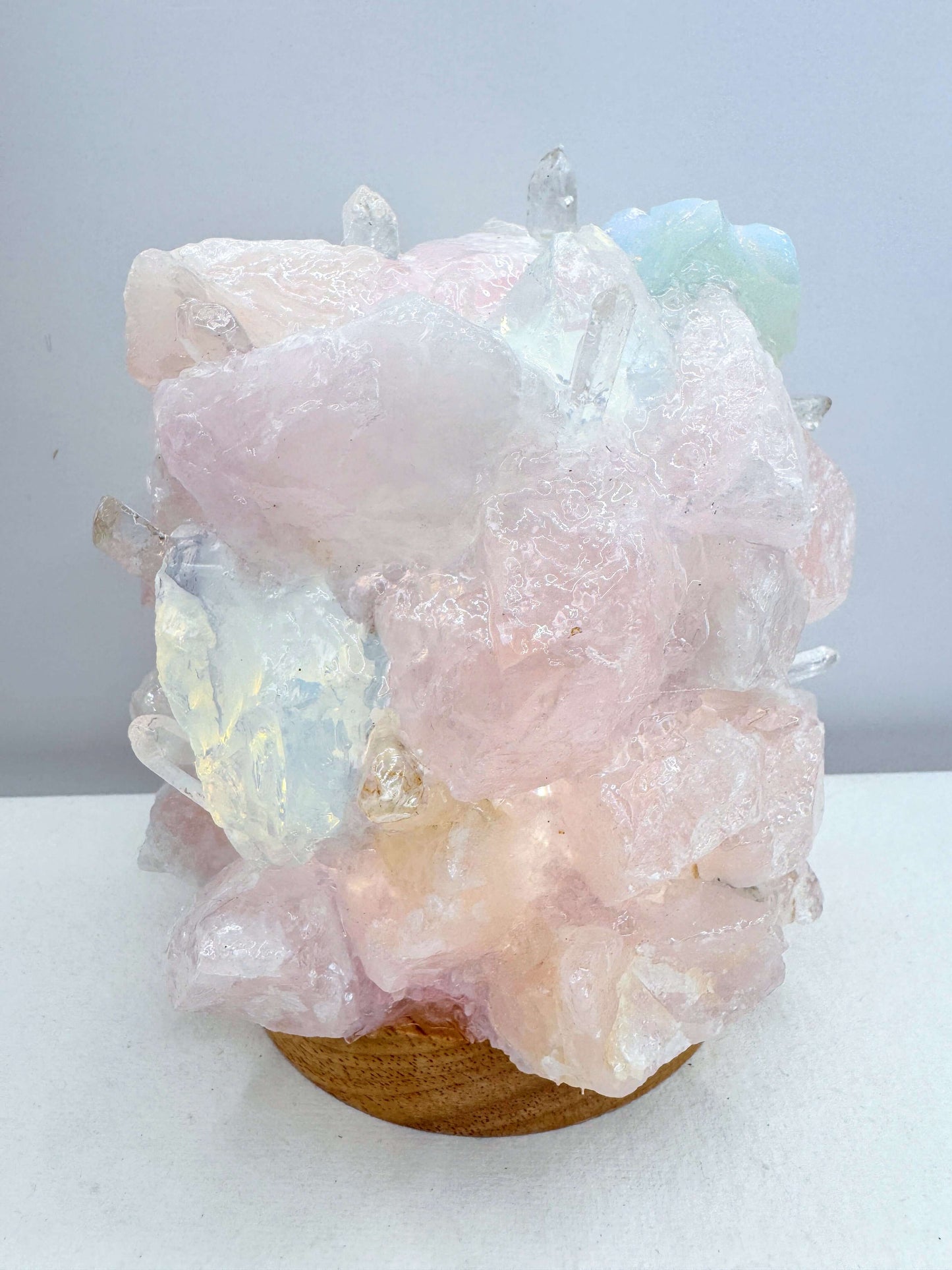 Rose quartz opalite crystal dome lamp showcasing natural crystals with vibrant colors in a unique design.