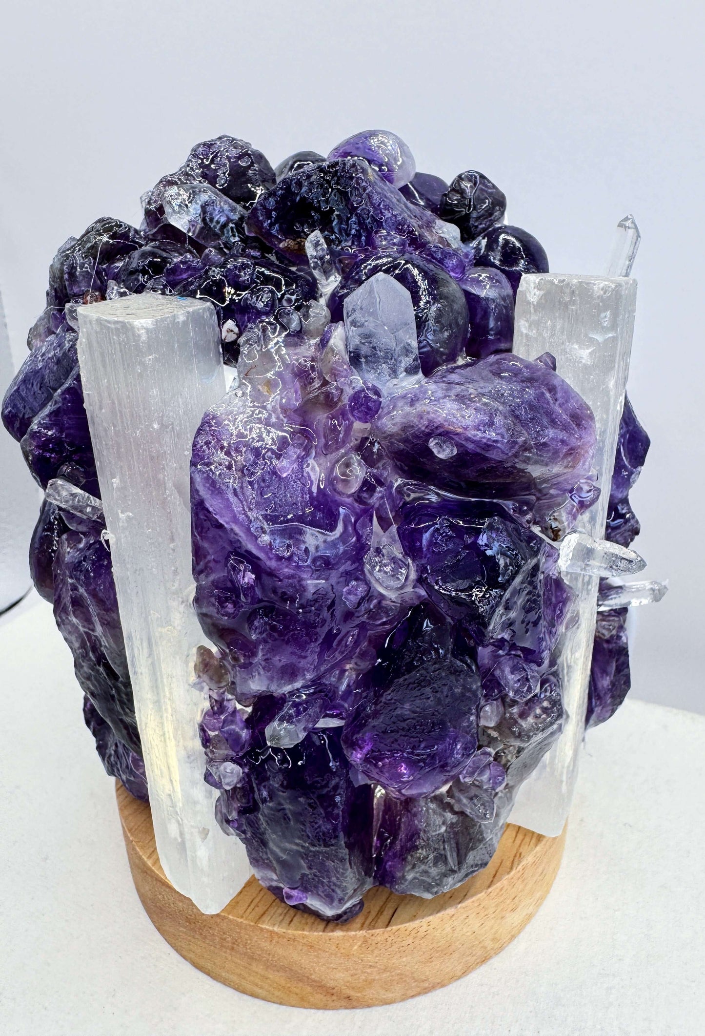 Amethyst/Selenite Dome Lamp showcasing unique crystal artistry with USB-powered LED base, emitting a warm glow.
