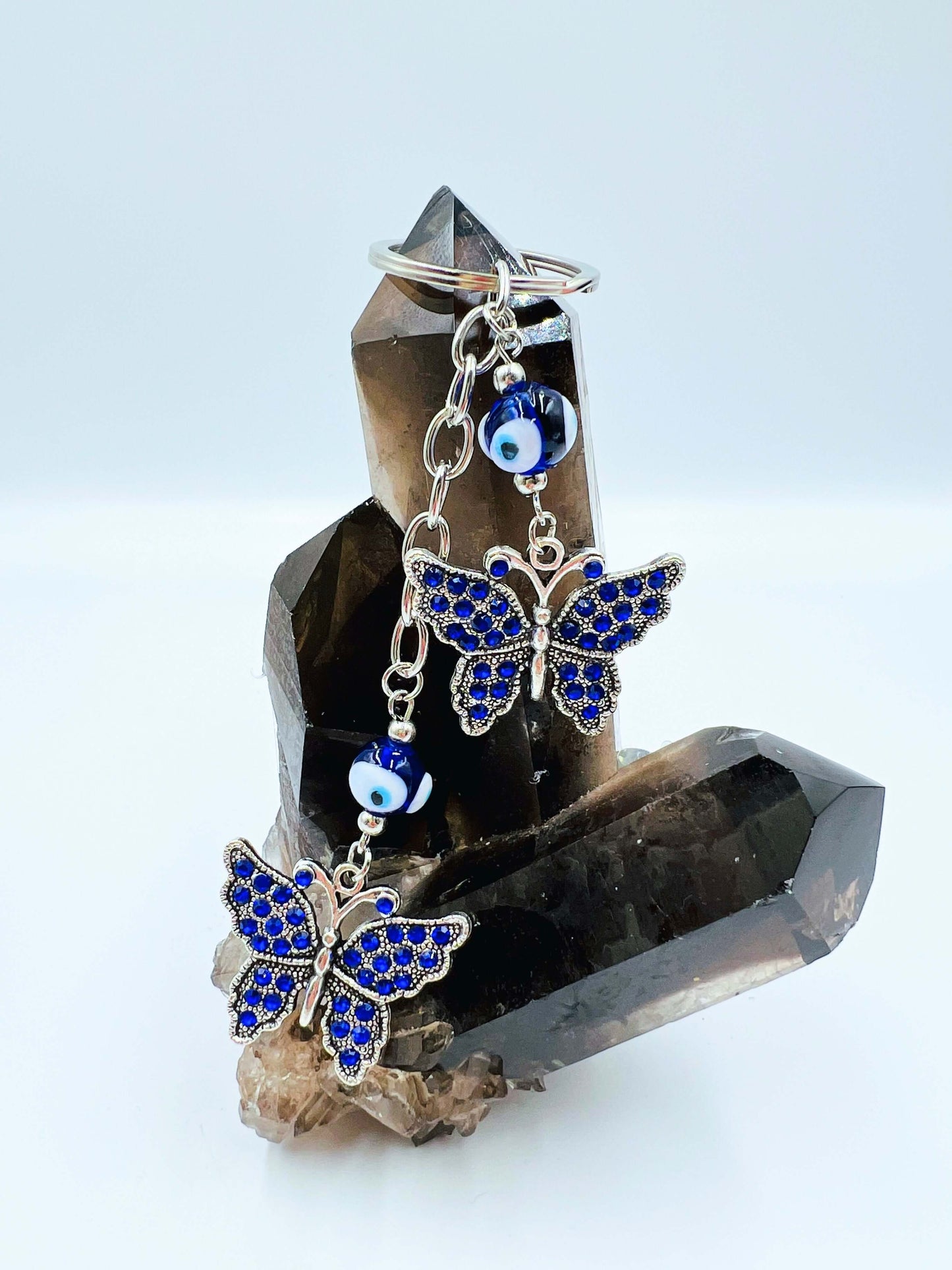 Evil Eye key ring on smoky quartz crystal.