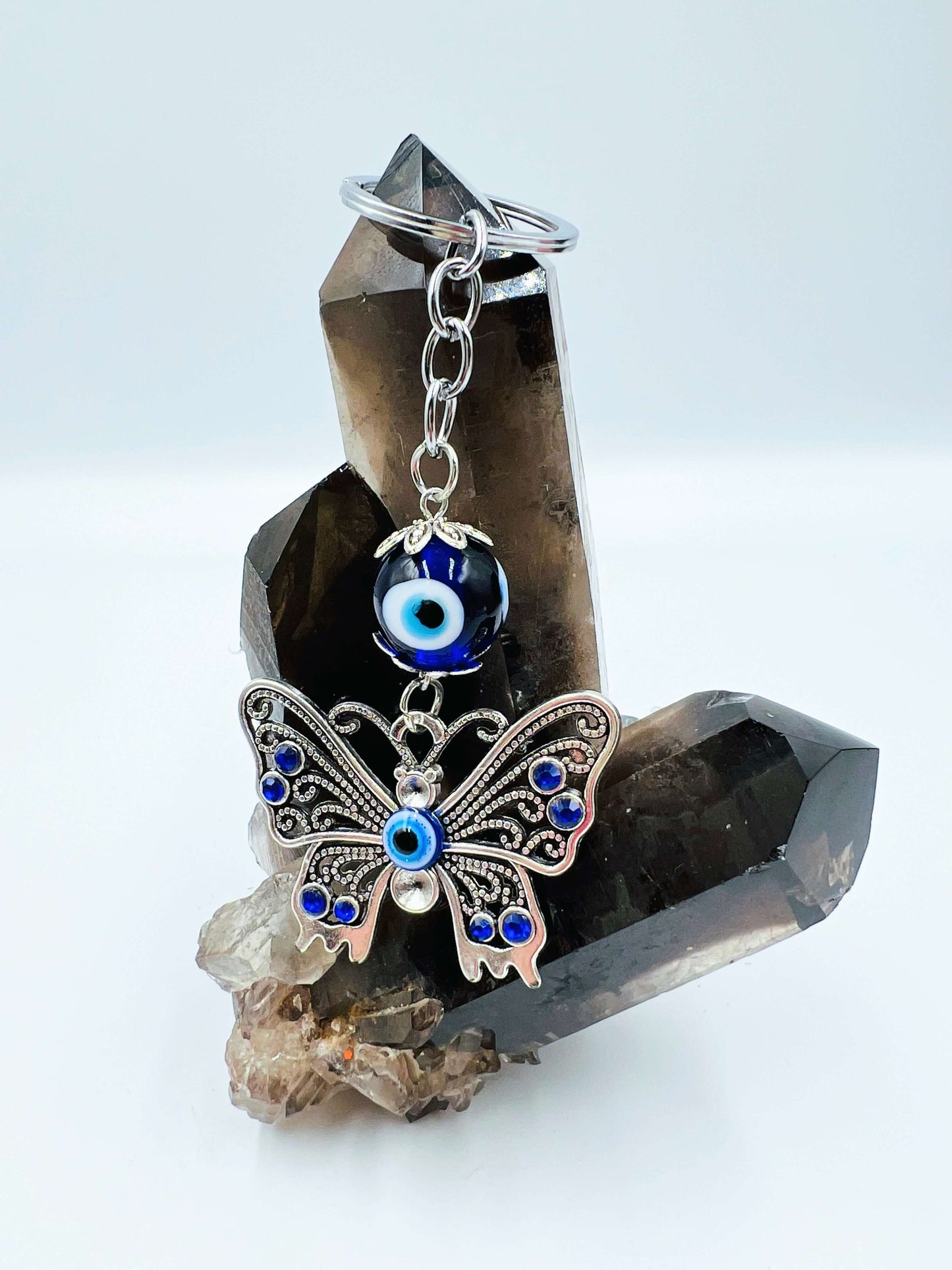 Evil Eye key ring on smoky quartz crystal.