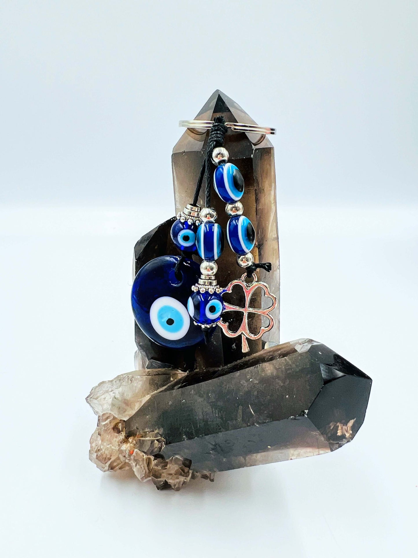 Evil Eye key ring on smoky quartz crystal.