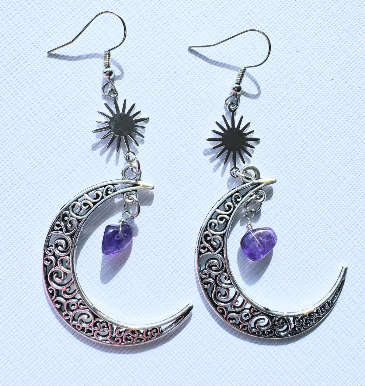 Crescent moon with crystal earrings.