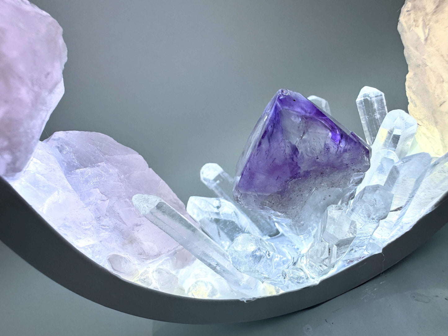 Crystal lamp featuring rose quartz and a central amethyst point with clear quartz accents.