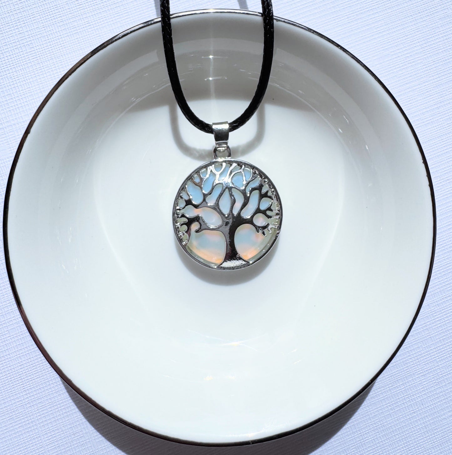 Tree of life round crystal pendants.