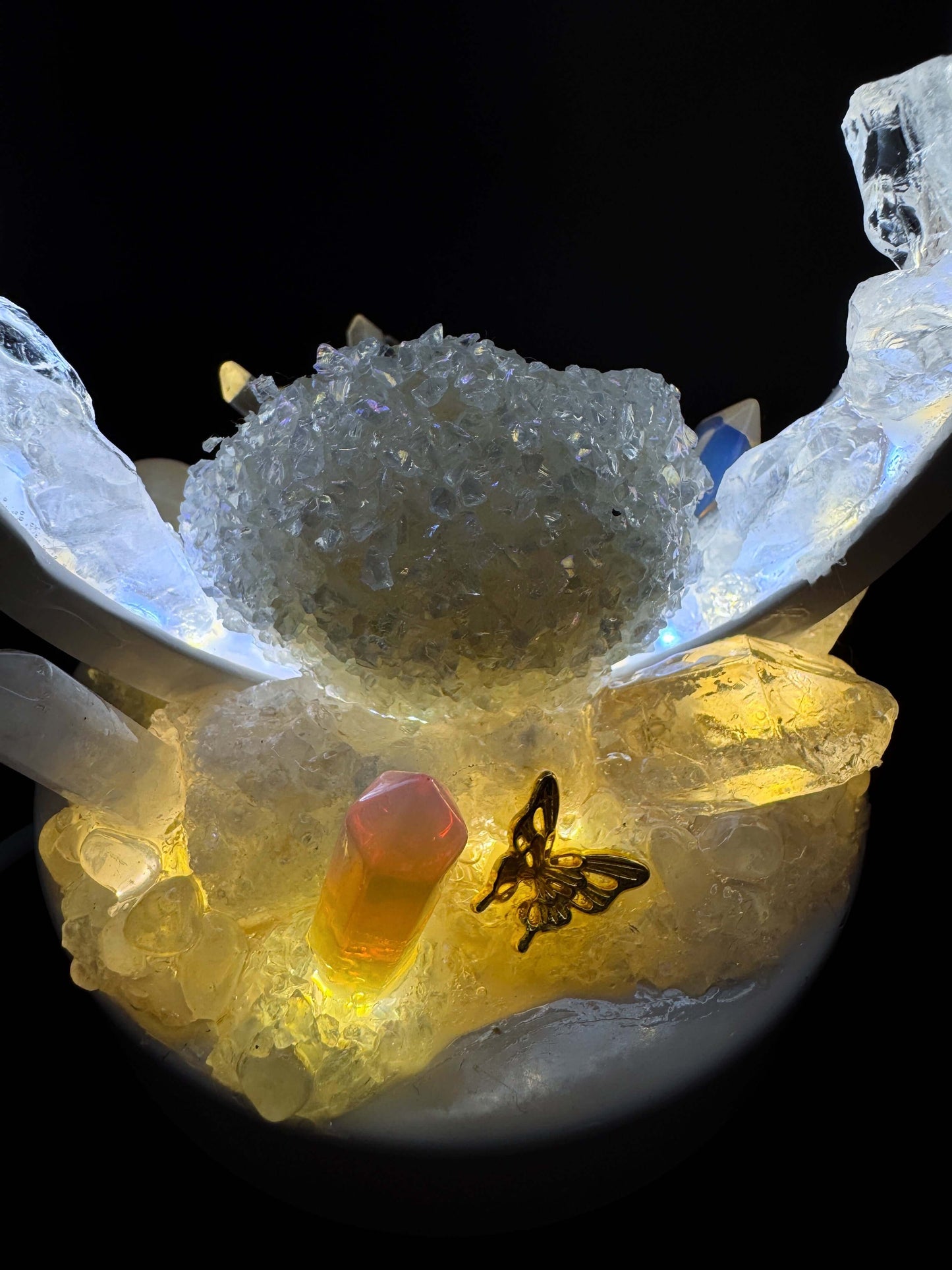 Elegant close-up of an Angel Flame Crystal Lamp showcasing vibrant crystals and a glowing center.