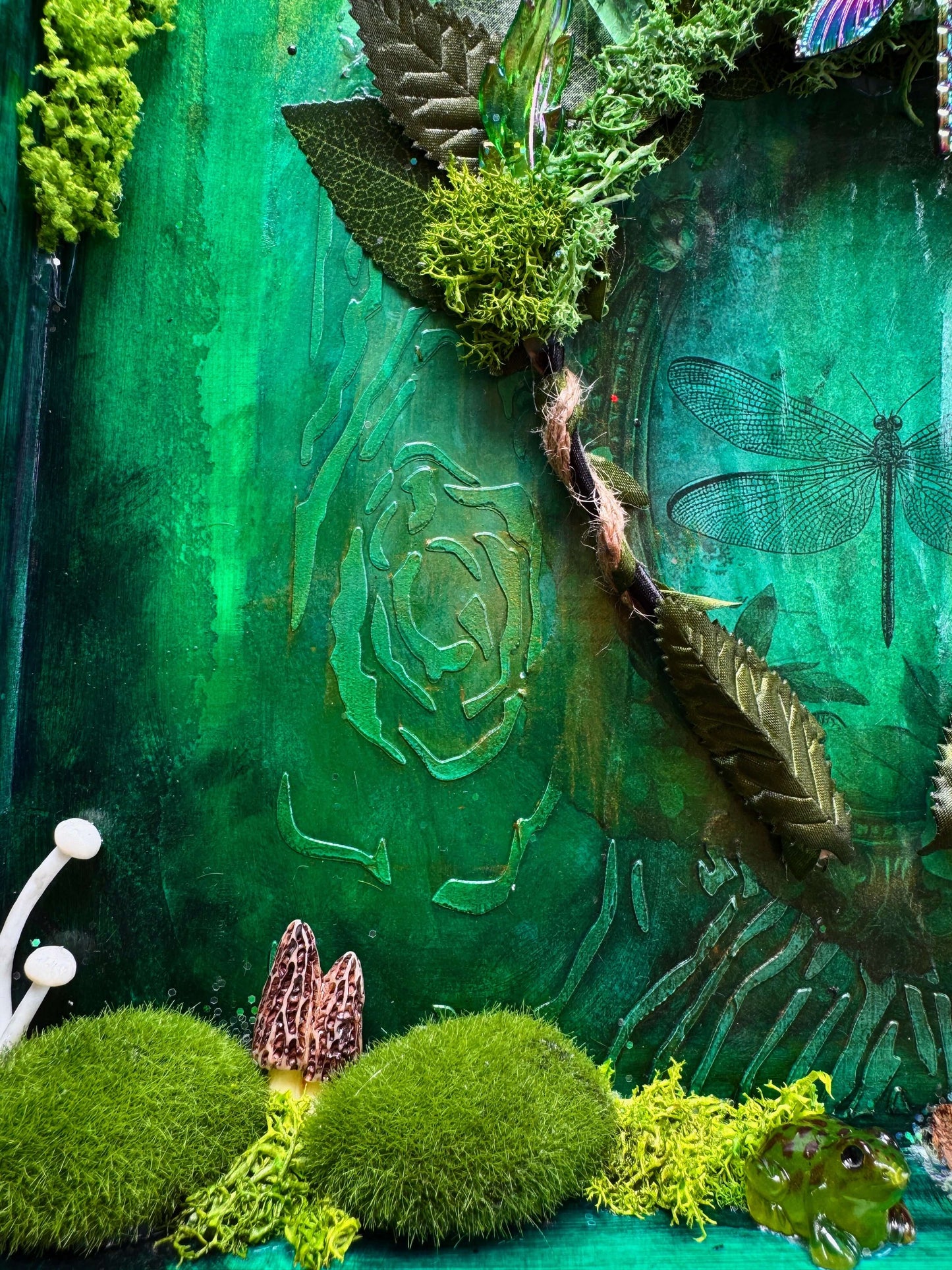 Crystal art mixed-media shadow box with green moss and natural elements showcasing enchanted forest theme.