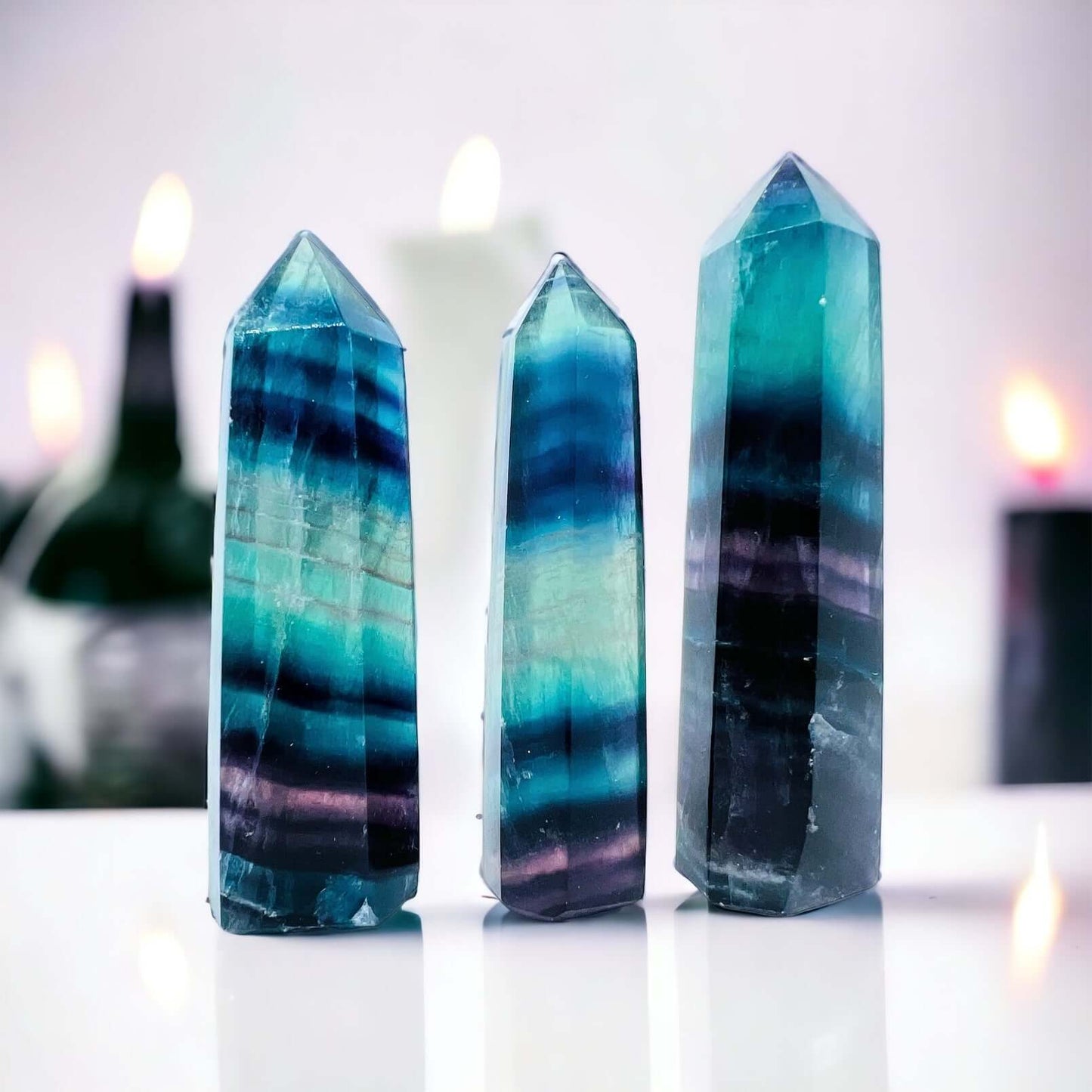 Several fluorite towers on white surface.