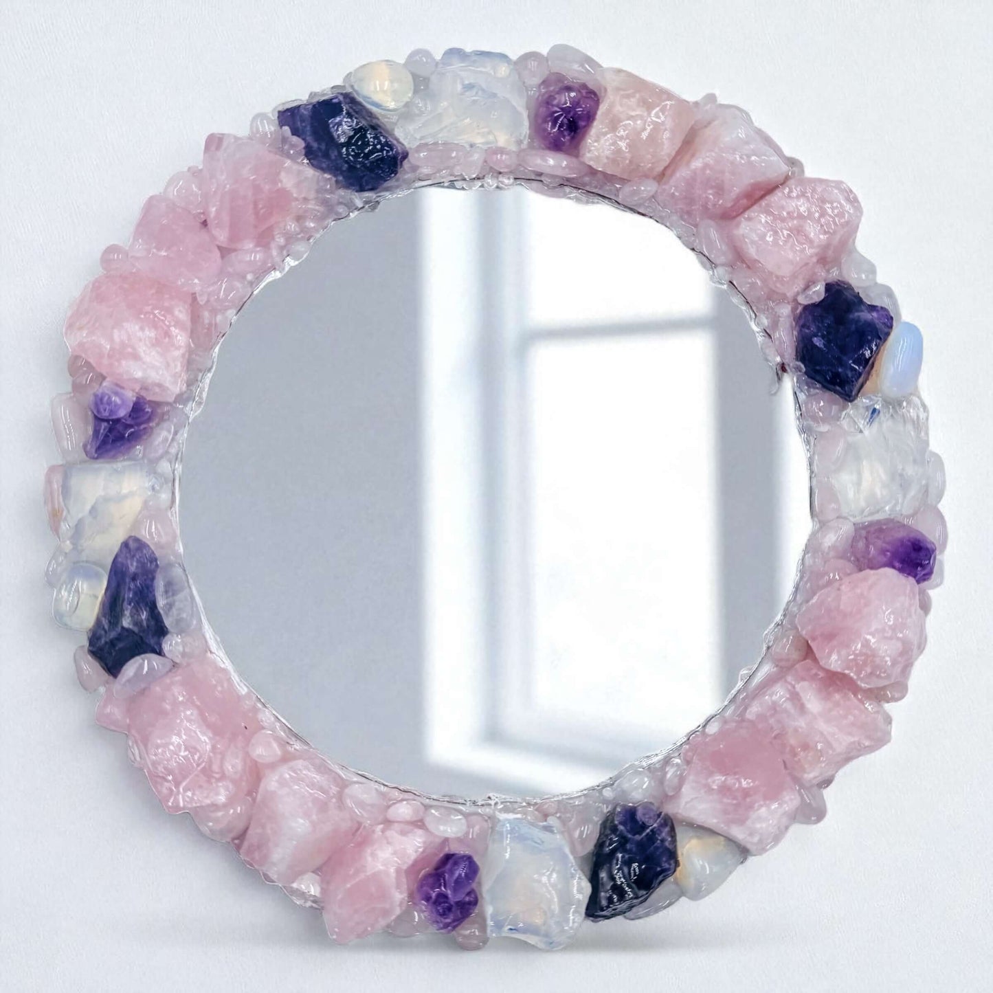 Crystal mirror with Rose Quartz, Amethyst, and Opalite stones in a 25cm handcrafted design.