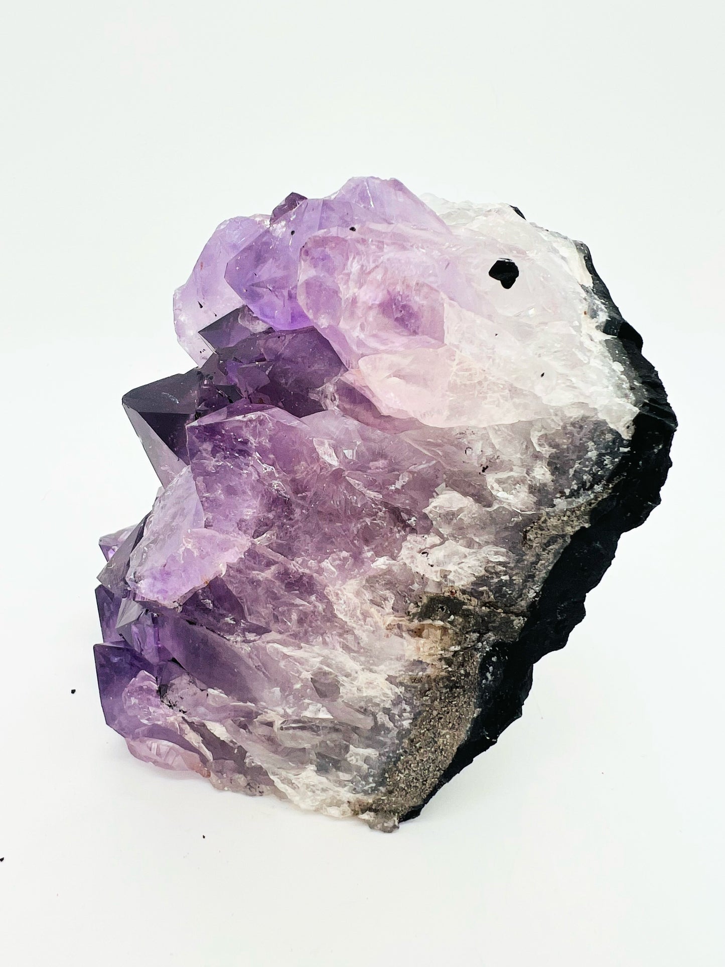 Large amethyst cluster on white background