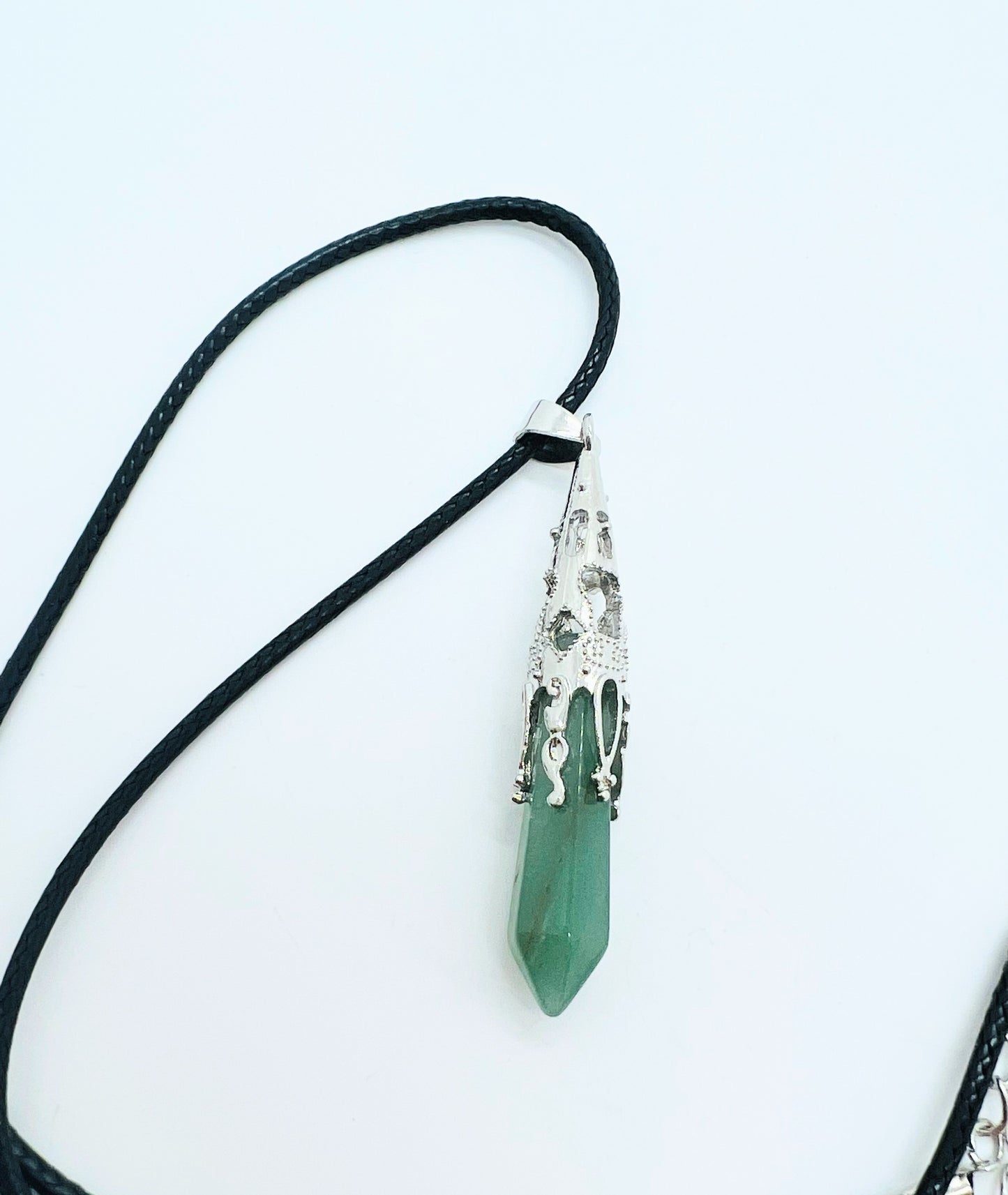 Green aventurine pendant on white background