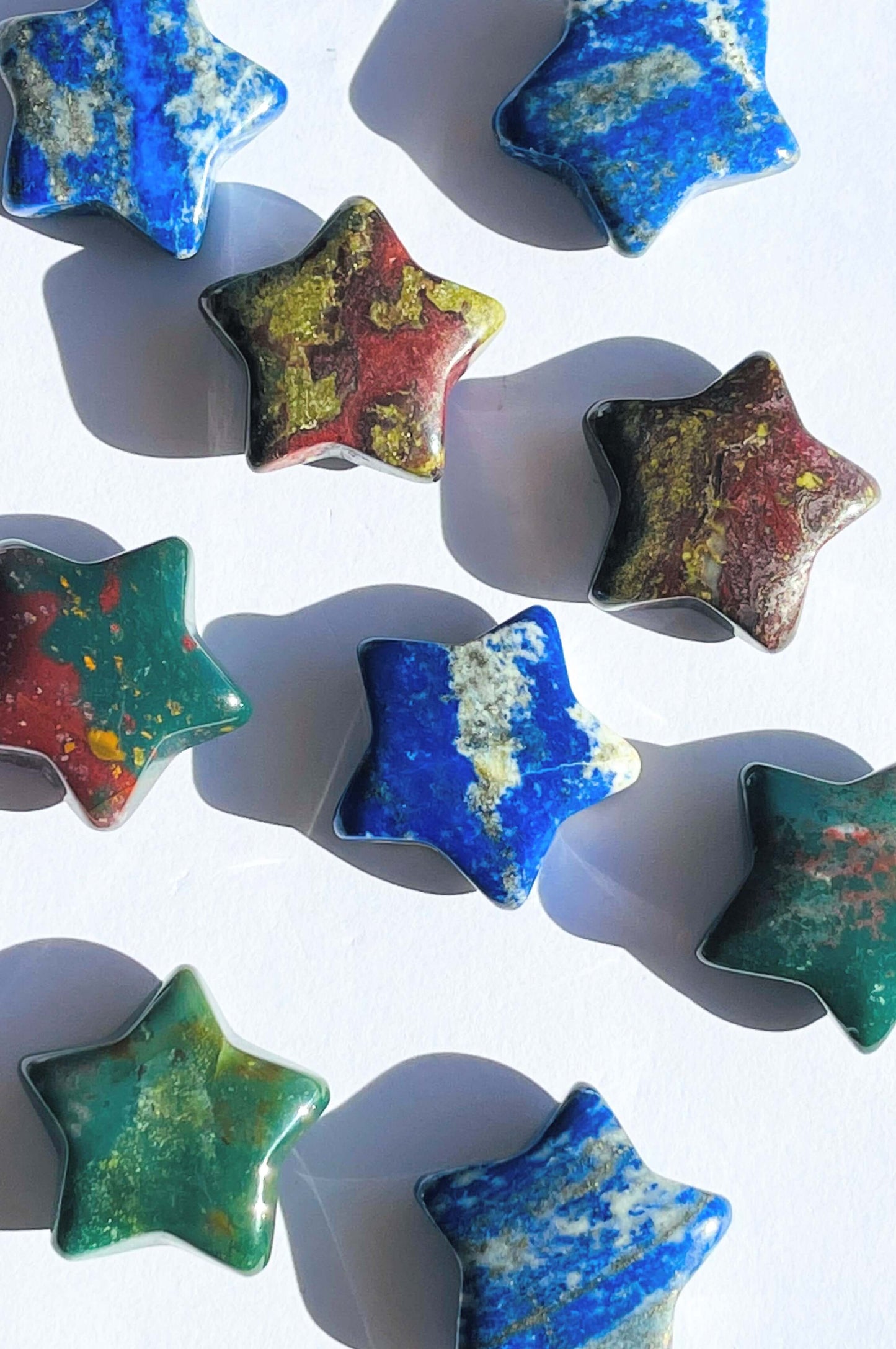 Several Crystal Stars on white surface.