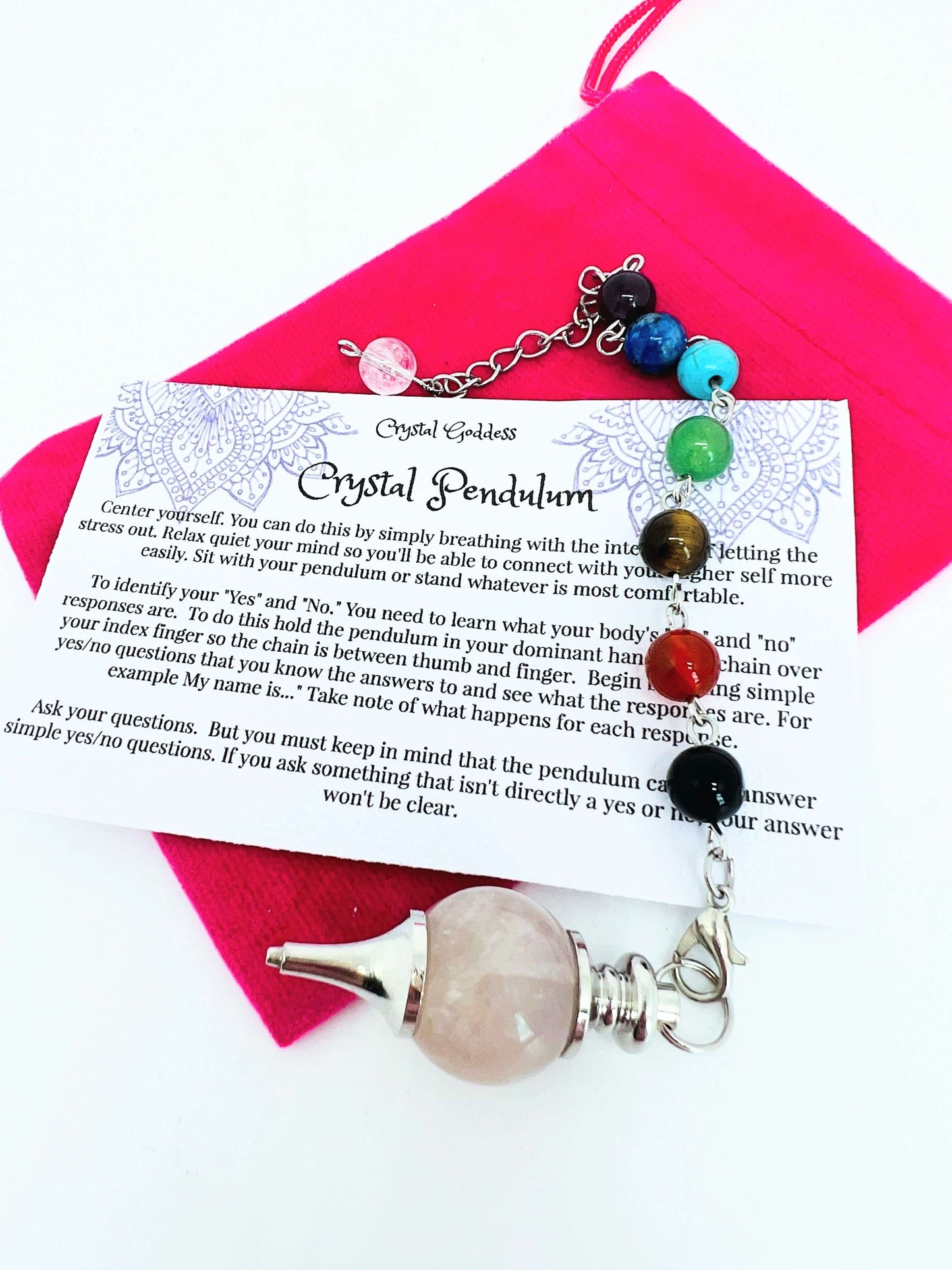 Crystal pendulum with chakra bead chain on pouch with instruction card