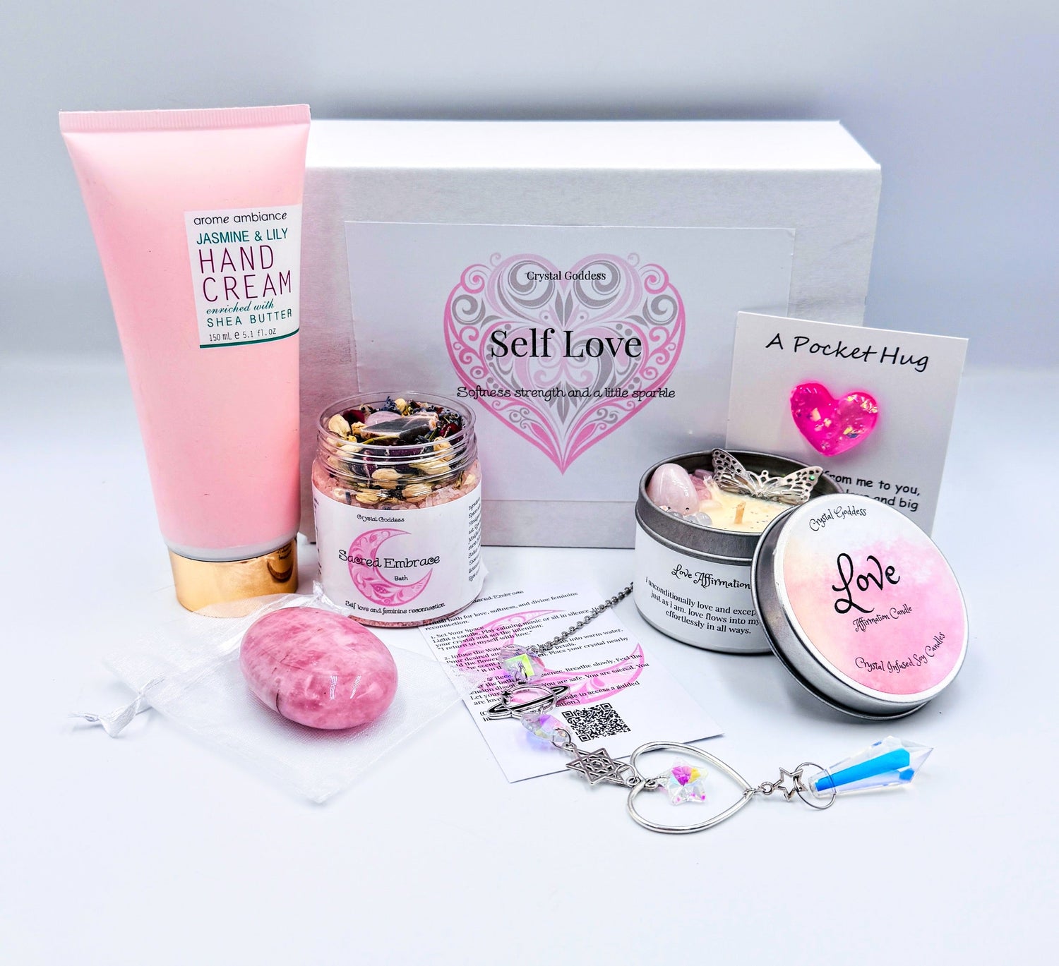 "Gift box with assortment of crystals and candles"