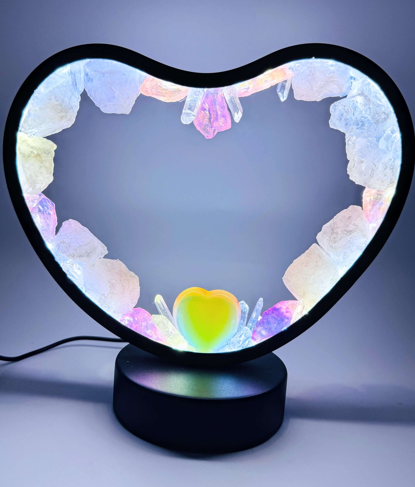 Crystal heart lamp with rose quartz and opalite glow, perfect for peace and love