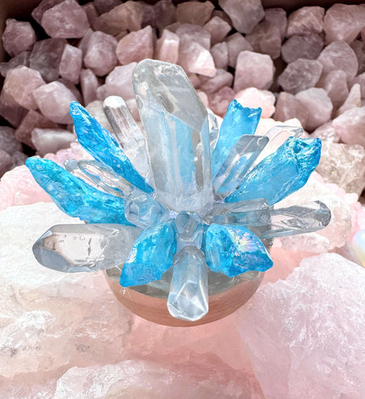 Crystal lamp with clear quartz and blue aura quartz on a wooden base