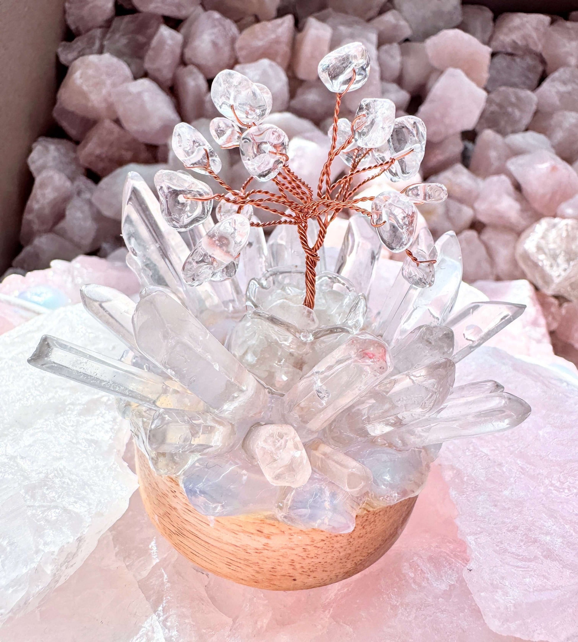 Crystal lamp featuring a clear quartz tree with opalite and quartz cluster, emitting a cool light from LED, creating a calming atmosphere.