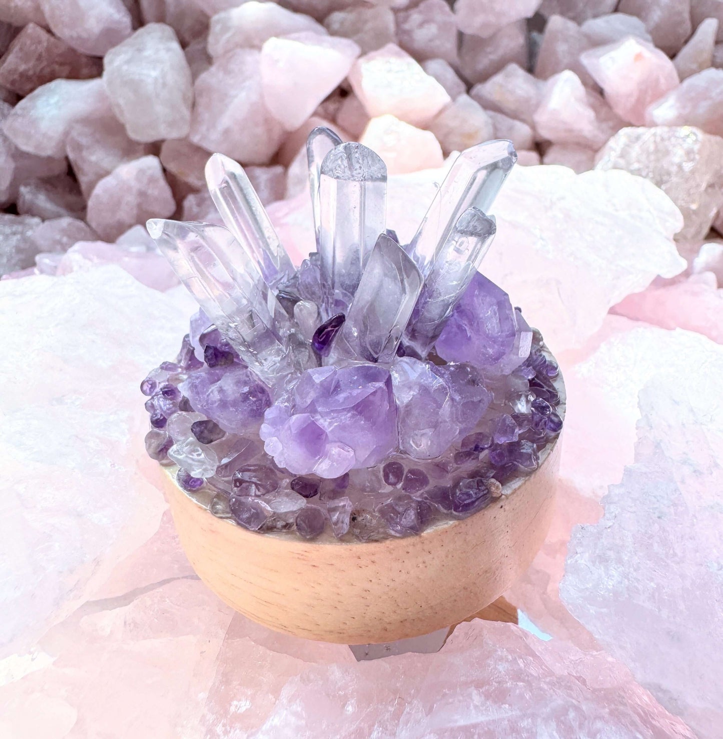 Crystal lamp with clear quartz and amethyst on a wooden base, cycling rainbow LED lights.