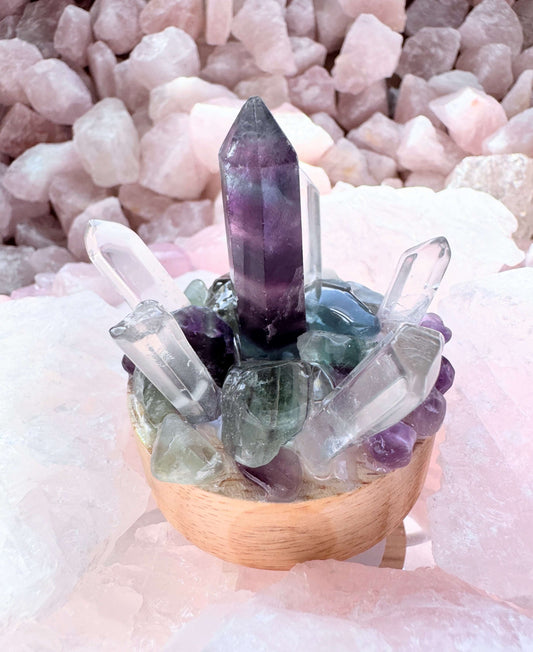 Crystal lamp with fluorite and clear quartz cluster on a wooden base, emitting cool white LED light for calming ambiance.