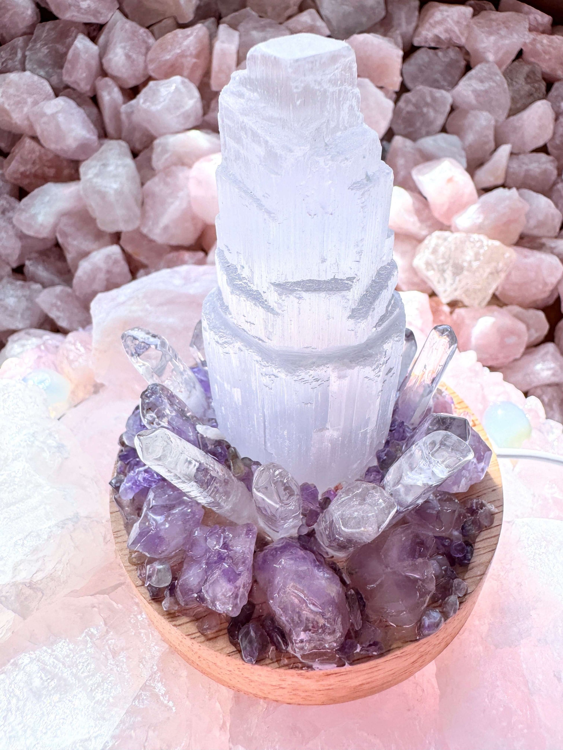 Crystal crystal lamp with selenite tower, amethyst, and clear quartz on a wooden base. Perfect for enhancing clarity and protection in any space.