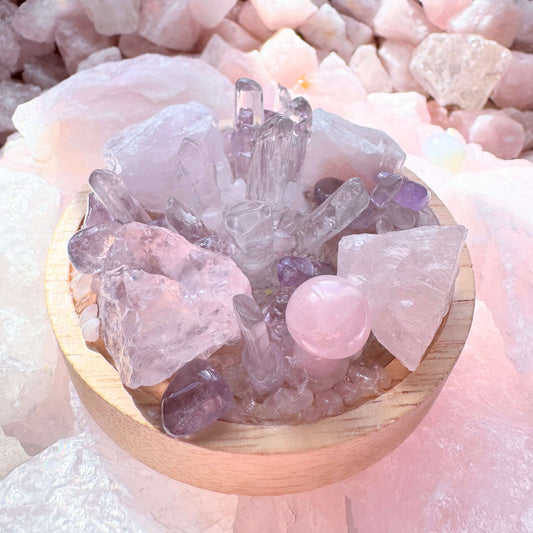 Crystal cluster lamp with rose quartz, clear quartz, and amethyst stones, emitting soft LED light, promoting emotional healing and balance.