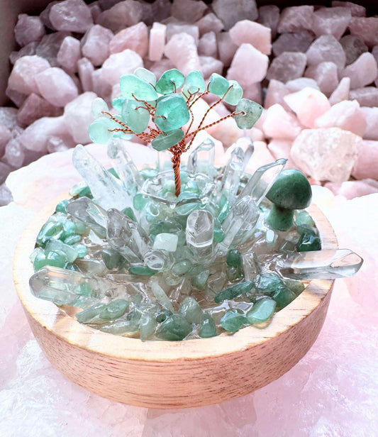 Crystal lamp featuring green aventurine tree with clear quartz points on a wooden base for growth and calm clarity.