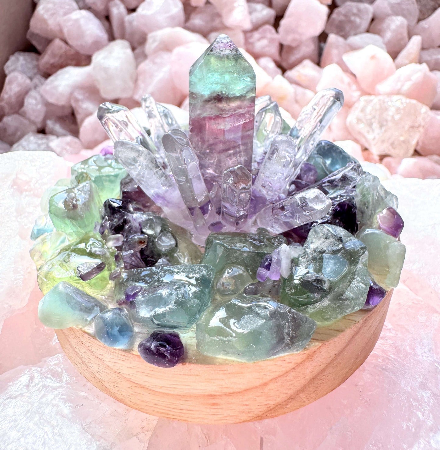 Crystal lamp featuring rainbow fluorite tower and clear quartz points on wooden base for harmony and mental clarity.