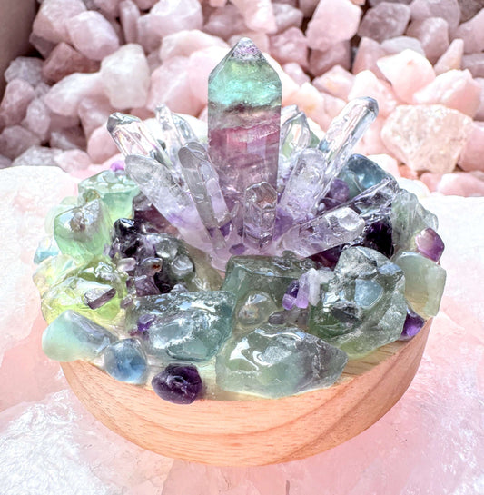 Crystal lamp featuring rainbow fluorite tower and clear quartz points on wooden base for harmony and mental clarity.