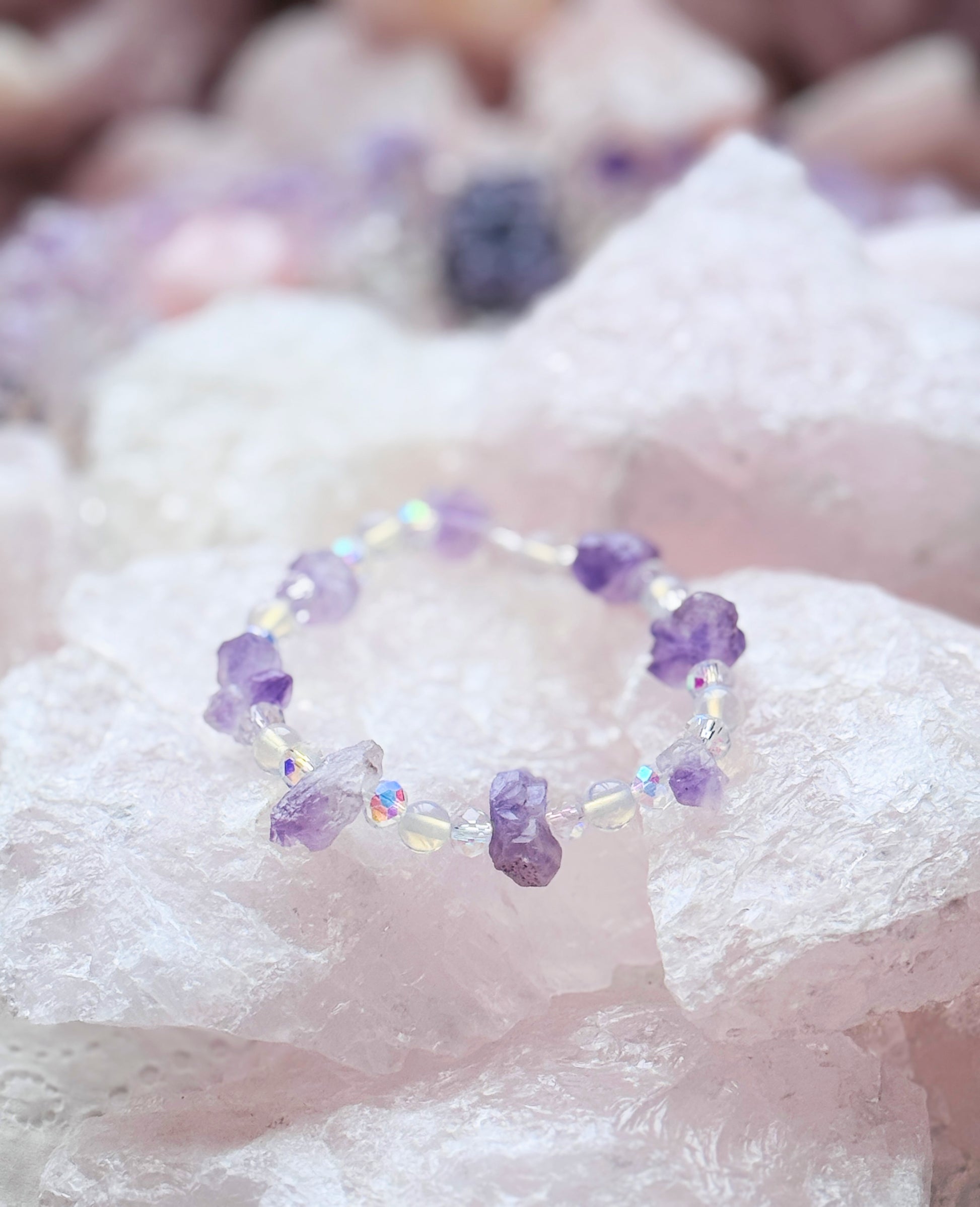 Crystal bracelet with genuine amethyst flower crystals and opalite beads showcasing a serene and luminous style.