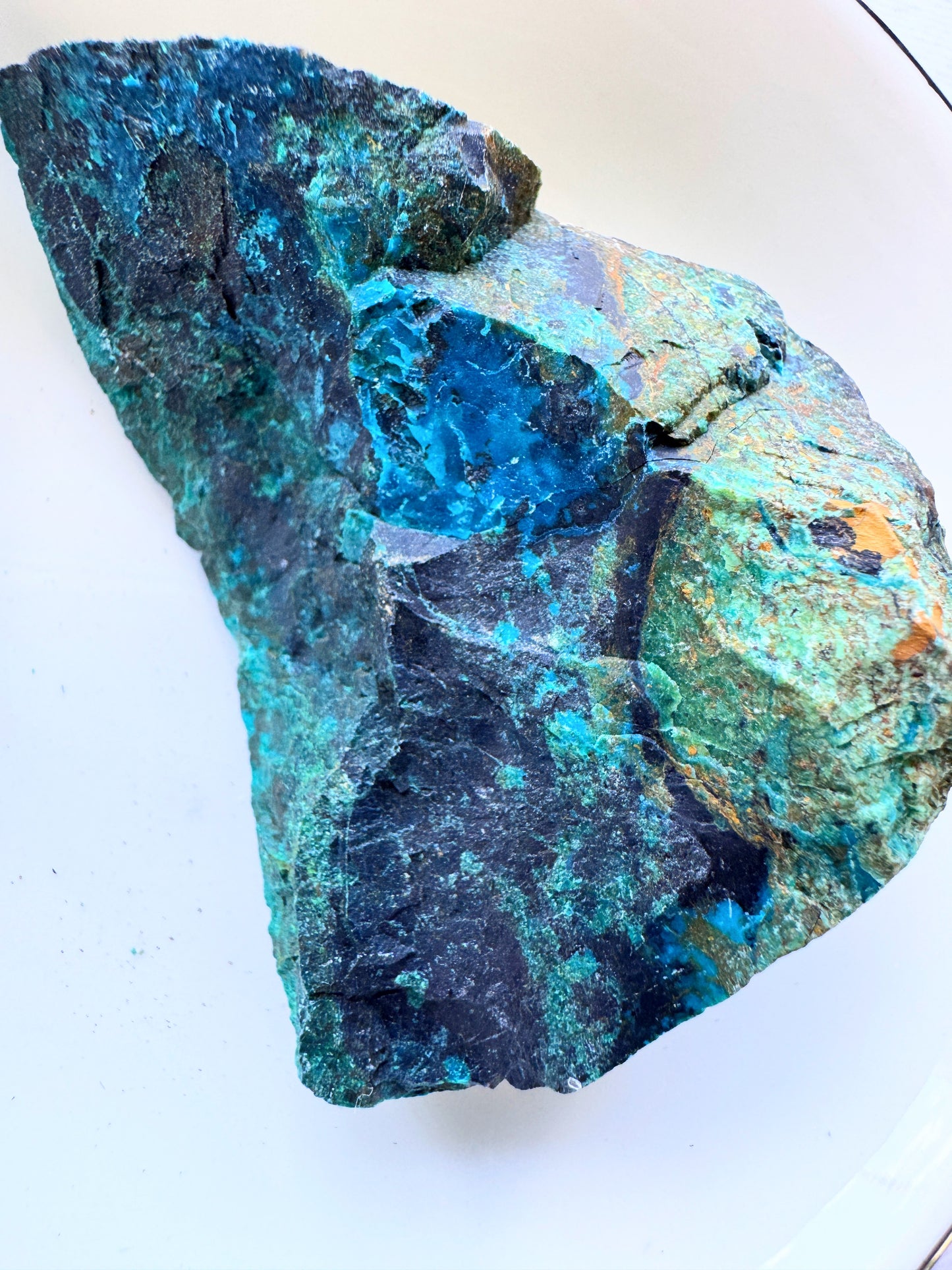 Rough chrysocolla specimens showcasing vibrant turquoise and blue-green hues in their natural form.