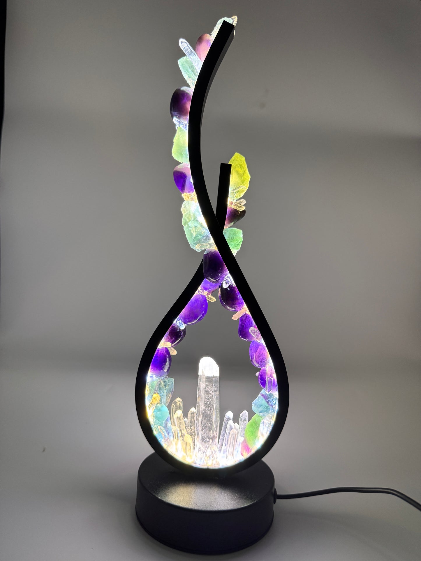 Crystal lamp with Fluorite, Amethyst, and Clear Quartz, 32cm flame design with vivid colors and sculptural elegance.
