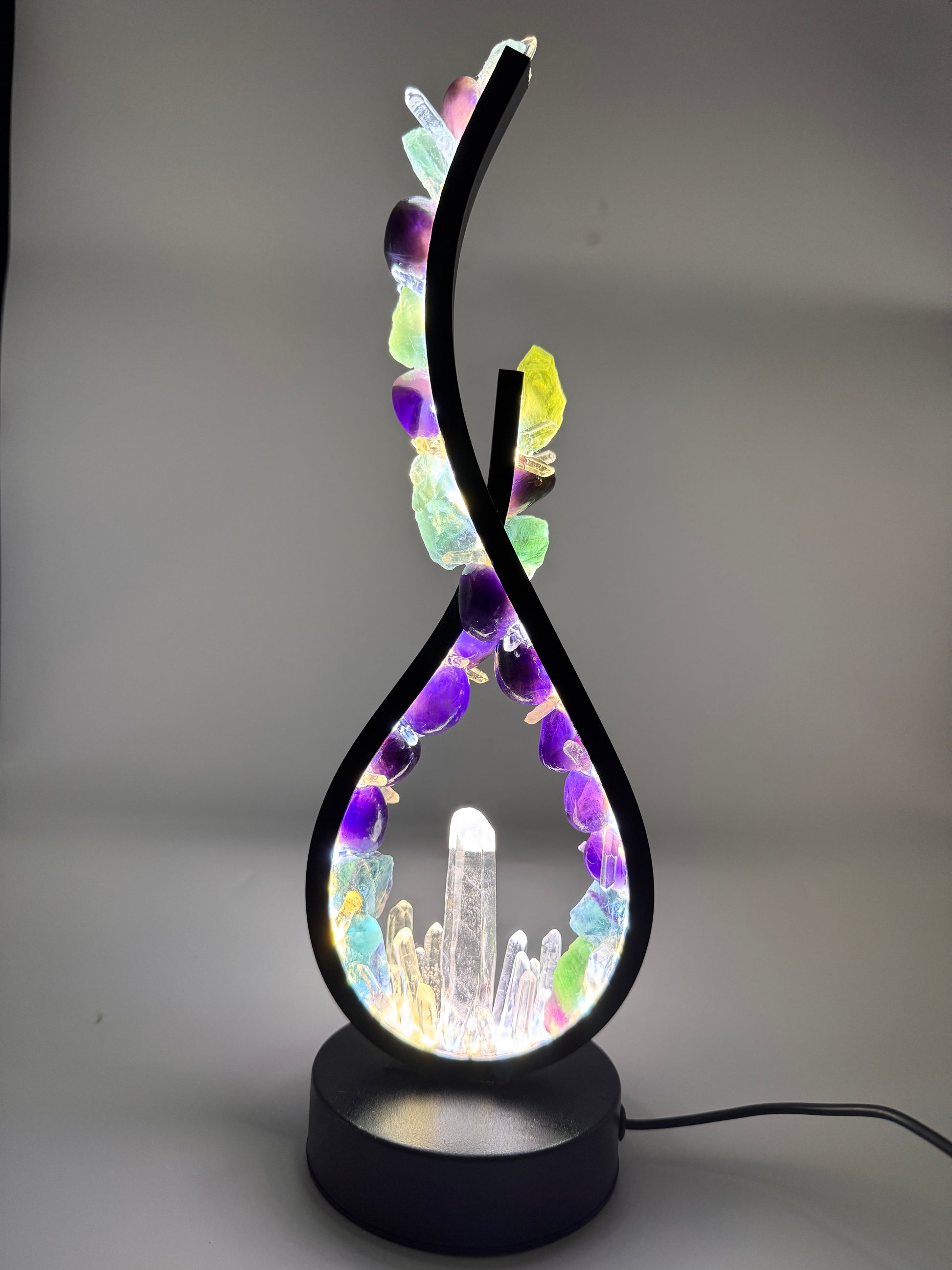Crystal lamp with Fluorite, Amethyst, and Clear Quartz, 32cm flame design with vivid colors and sculptural elegance.