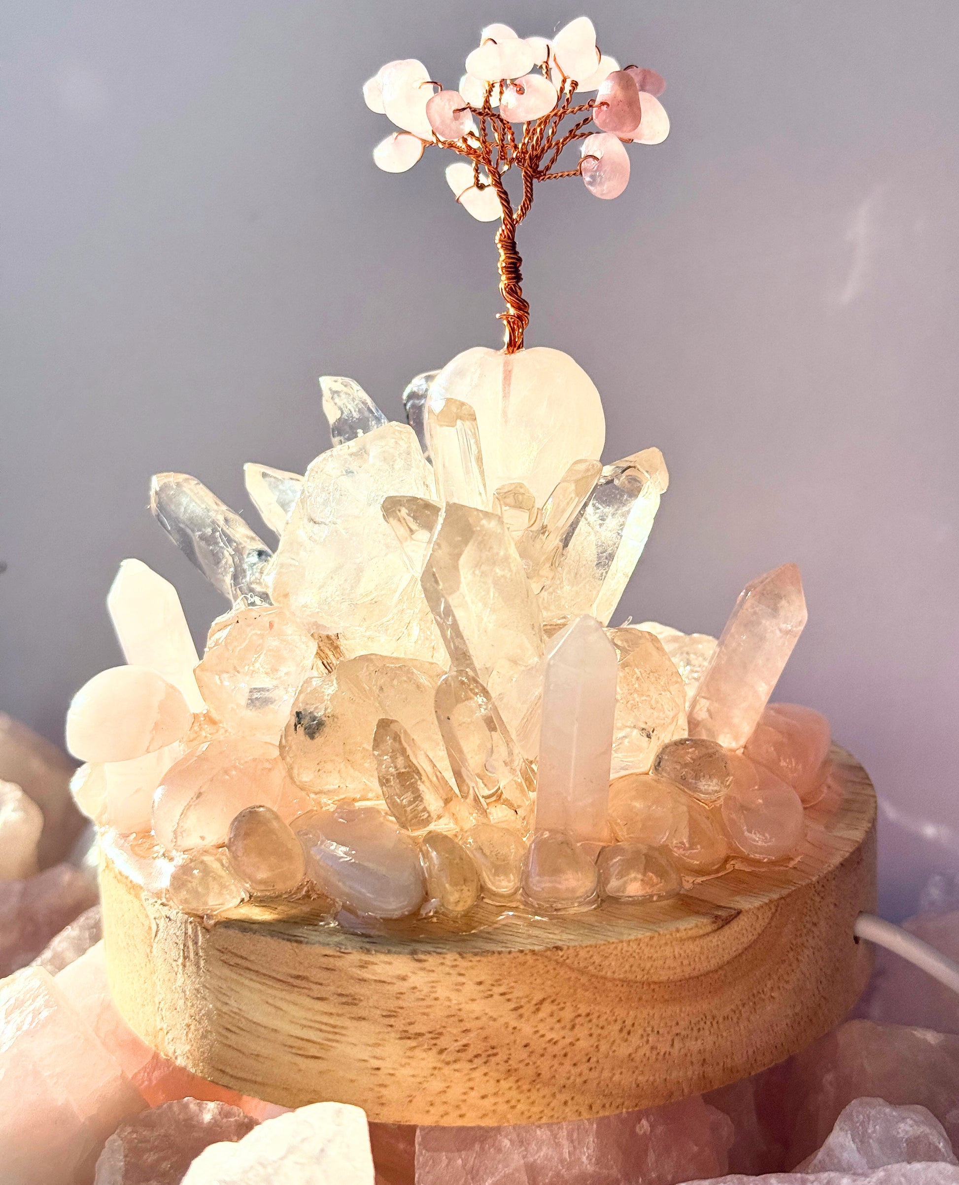 Rainbow Rose Quartz and Clear Quartz crystal cluster lamp with gemstone tree, creating a glowing and soothing ambiance.