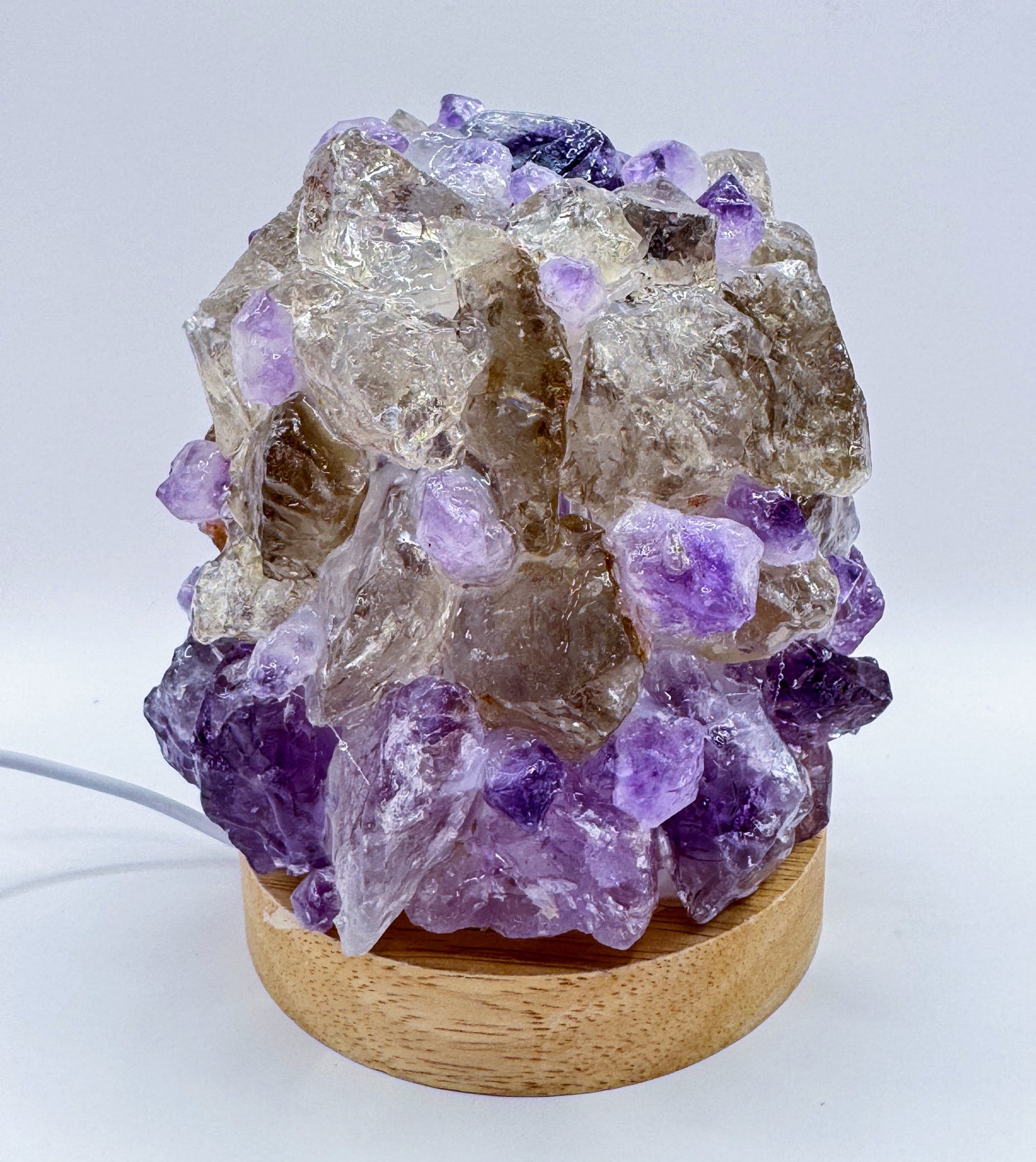 Amethyst and Smoky Quartz Crystal Lamp with 10cm base and 13cm height, featuring a handmade dome structure that glows when lit.