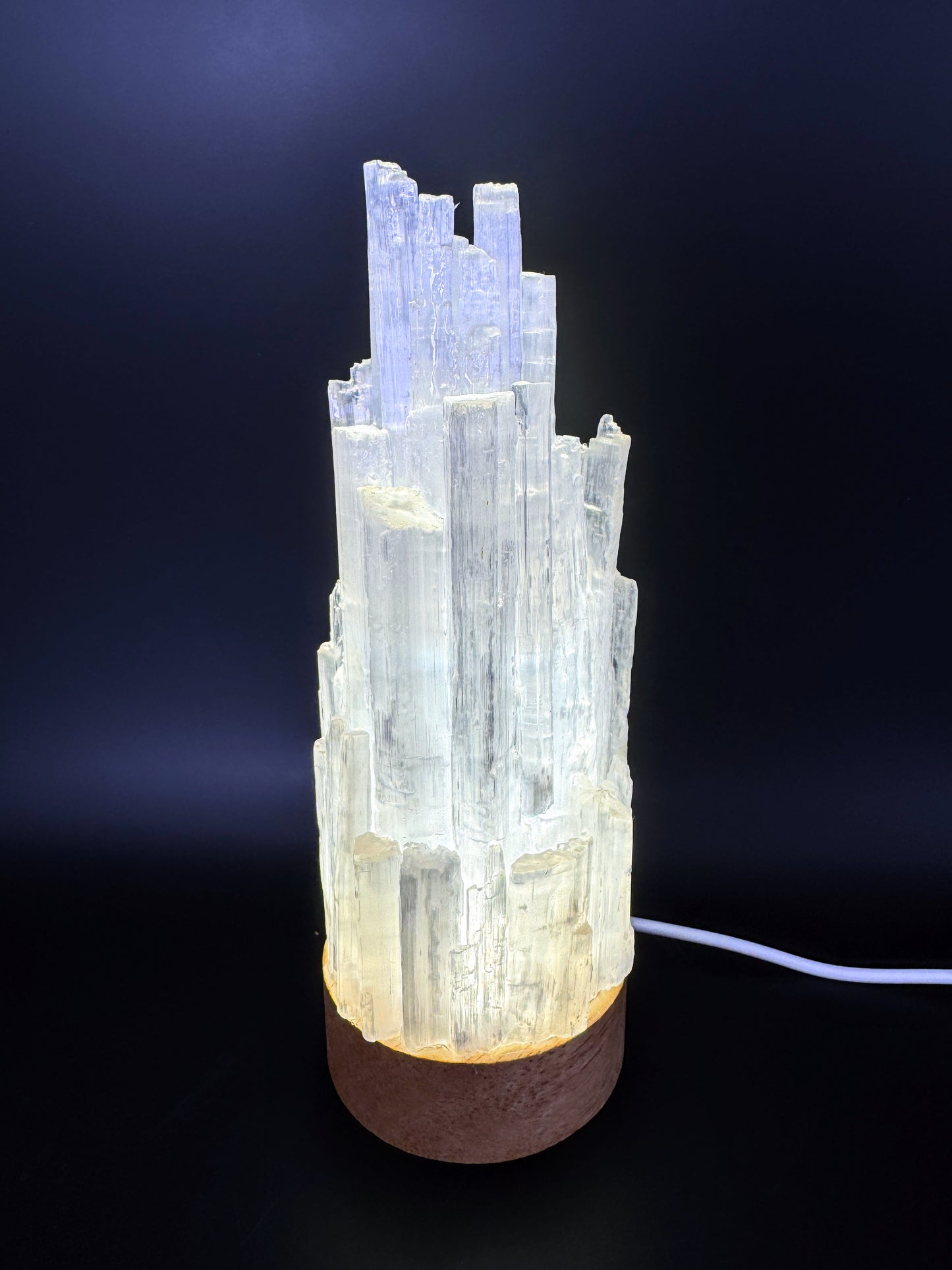 Handmade Selenite Crystal Lamp with 6cm base and 15cm height, featuring resin-coated natural selenite in a luminous white tower formation.