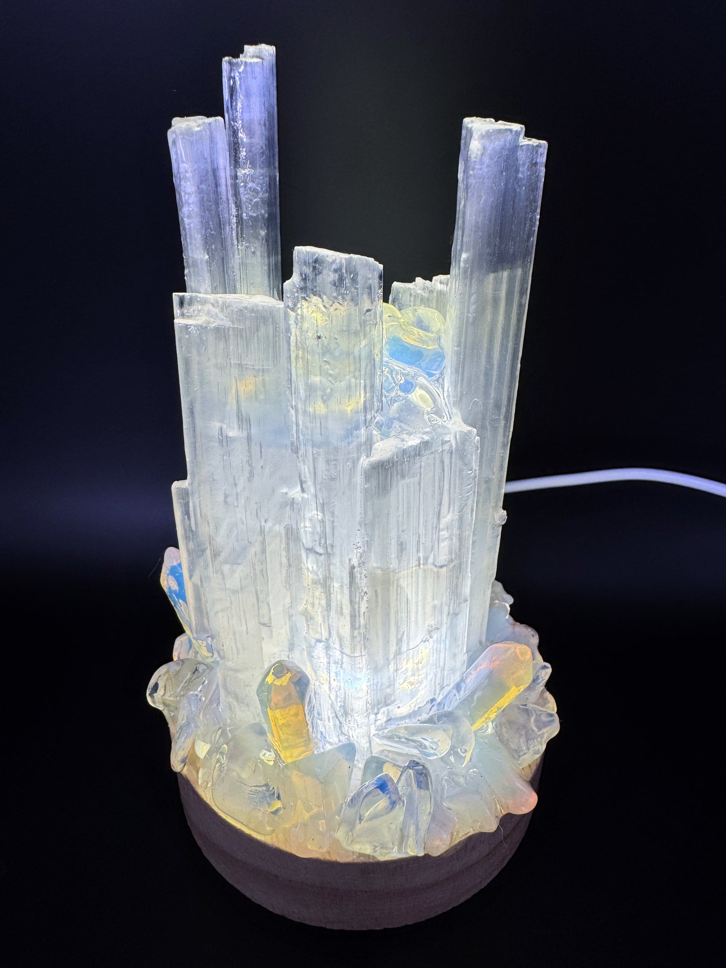 Selenite Crystal Lamp with opalite base glowing soft white light, handmade from natural selenite towers with resin-coated base.