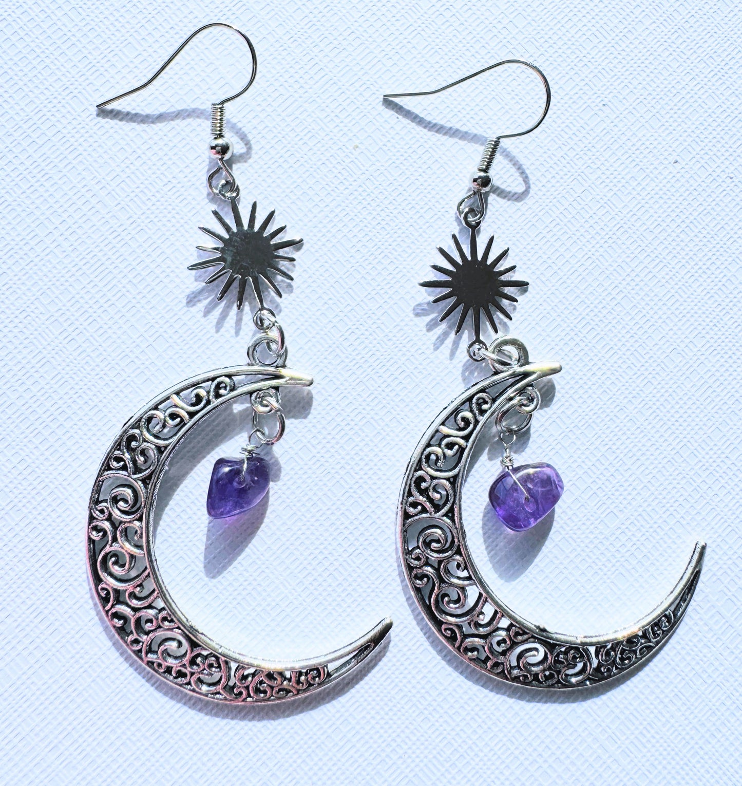 Crescent moon with crystal earrings.