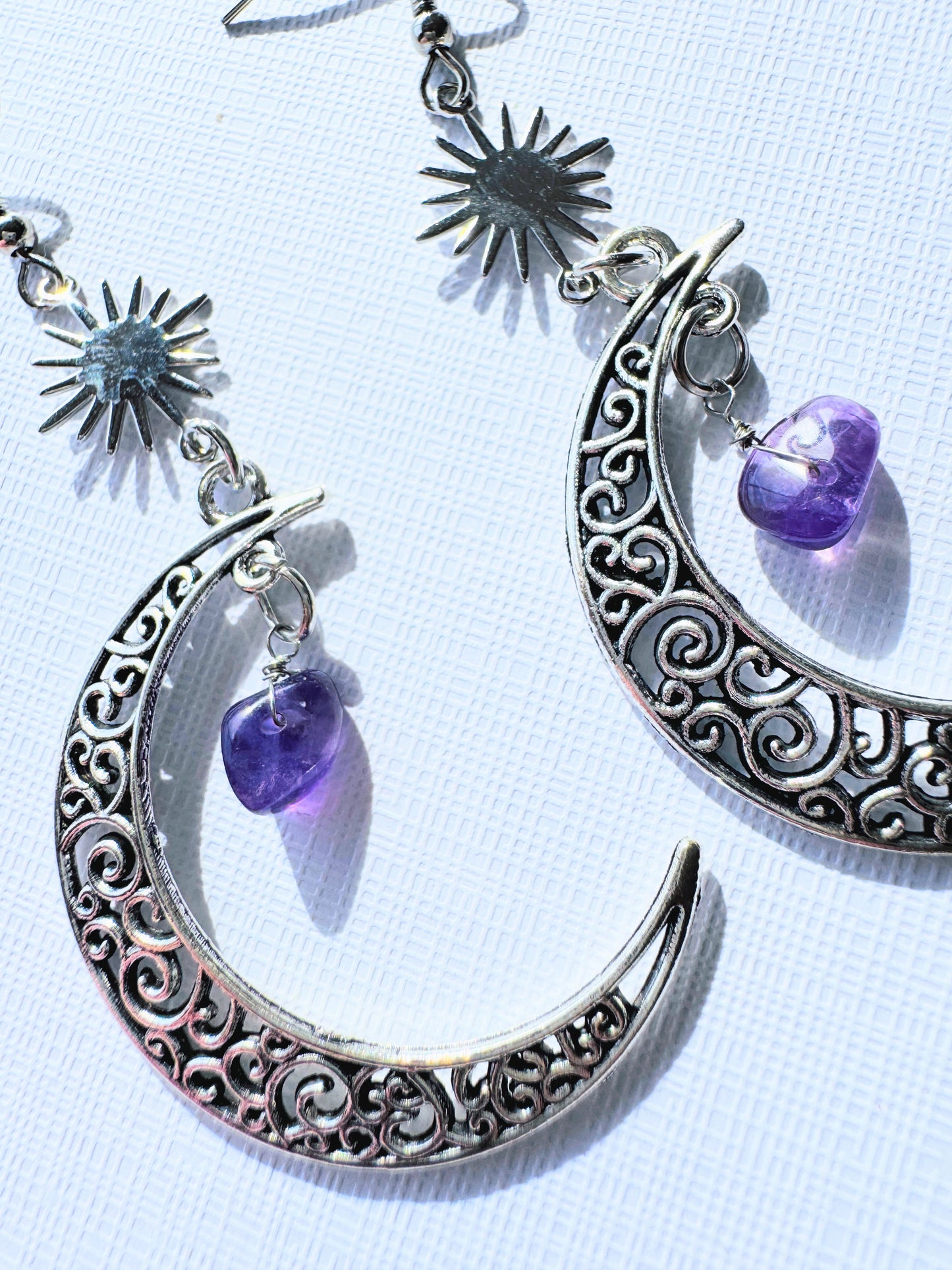 Crescent moon with crystal earrings.