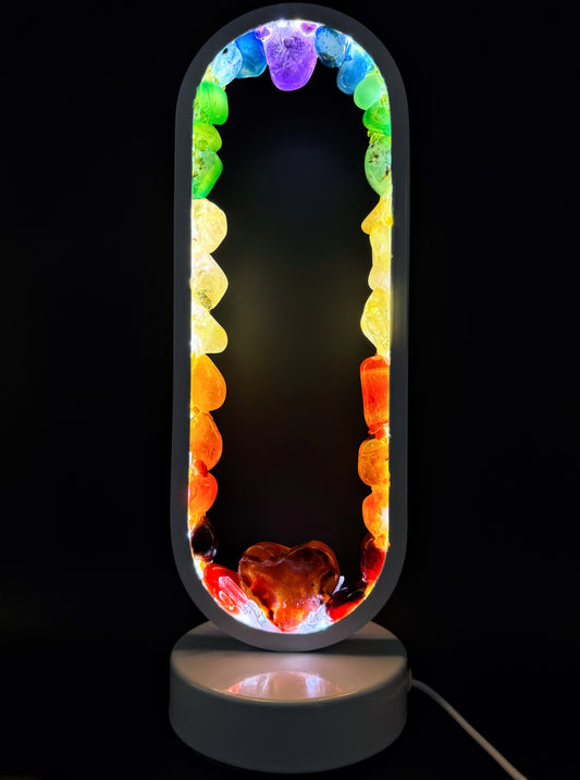 Crystal Lamp “Rainbow Love” featuring polished stones in a rainbow spectrum and a carnelian heart at the base.