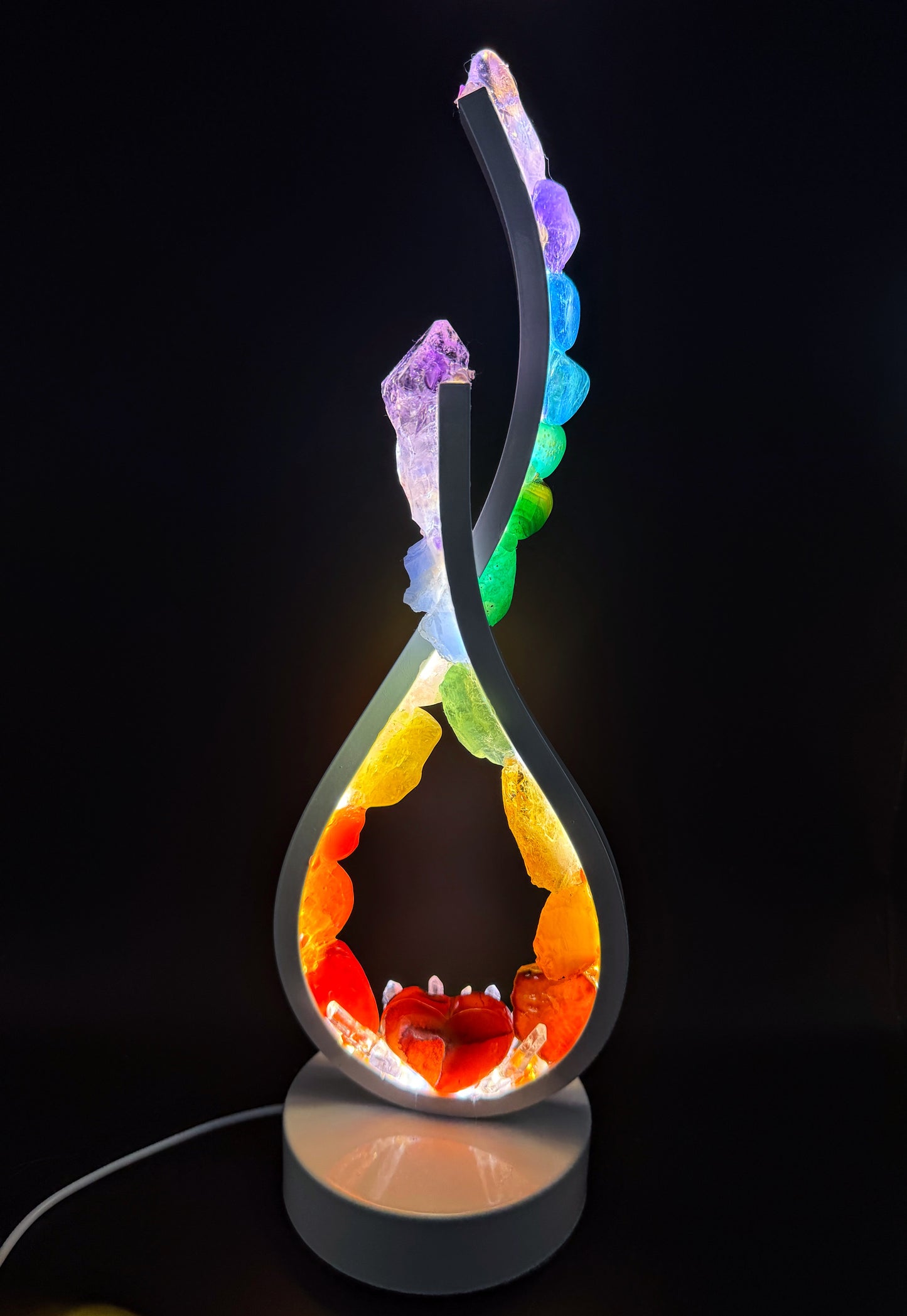 Rainbow Flame Crystal lamp showcasing vibrant stones and a polished finish, featuring a Carnelian heart.