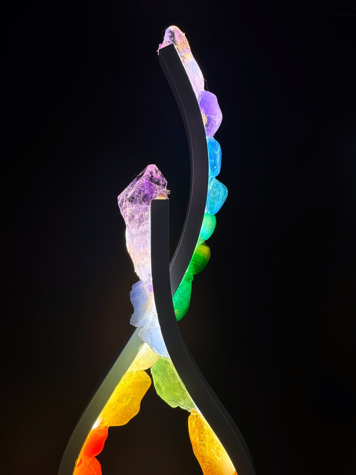 Flame Crystal Lamp “Rainbow Flame” with colorful stones and modern design illuminated in the dark.