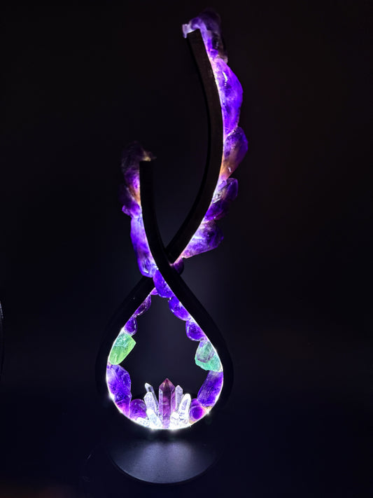 Flame Crystal Lamp "fluorite Dreams" illuminating a dark room with vibrant colors. Crystal Lamp design with unique shapes.