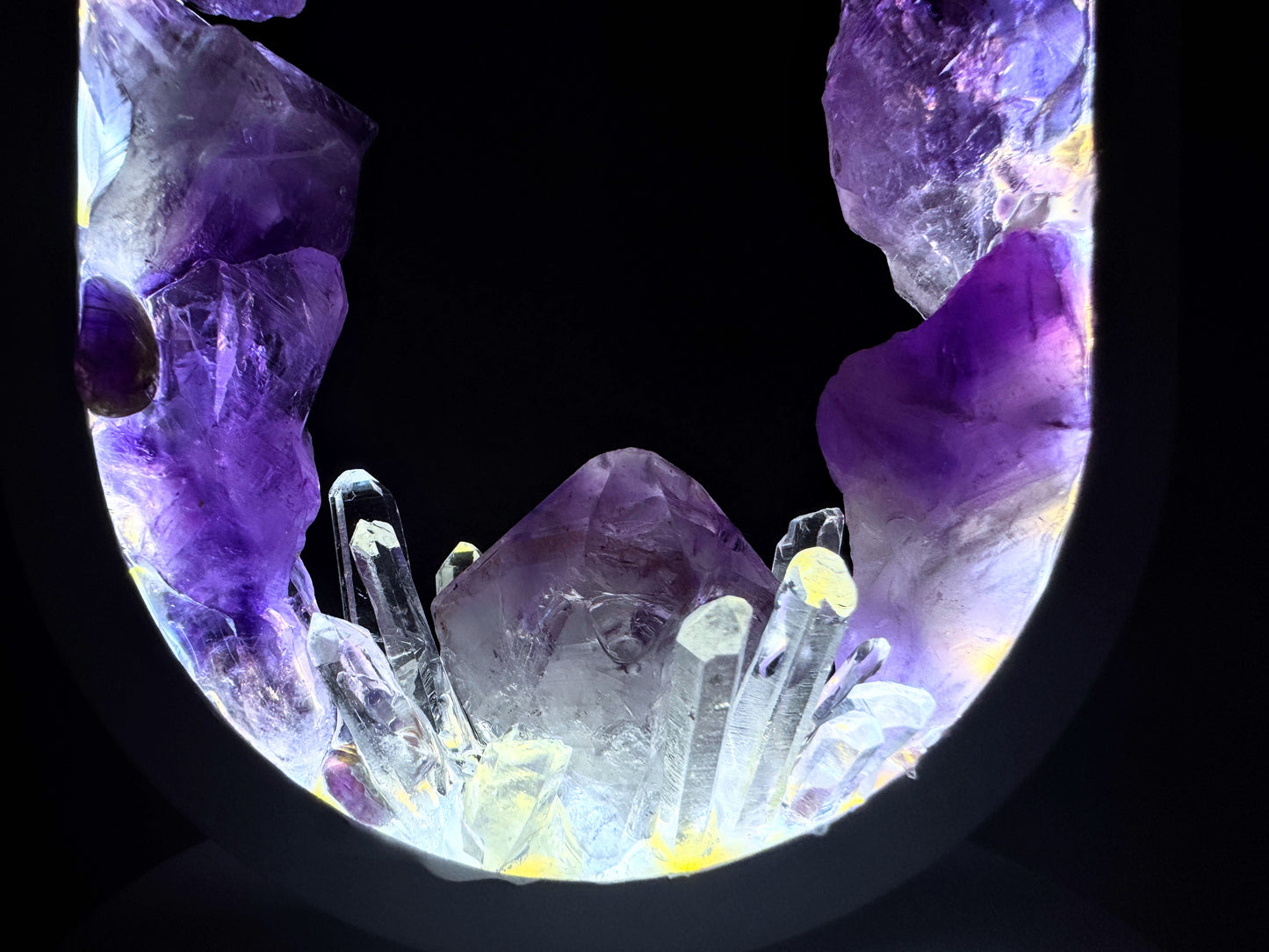 Crystal lamp featuring a stunning display of amethyst and clear quartz crystals in a portal design.