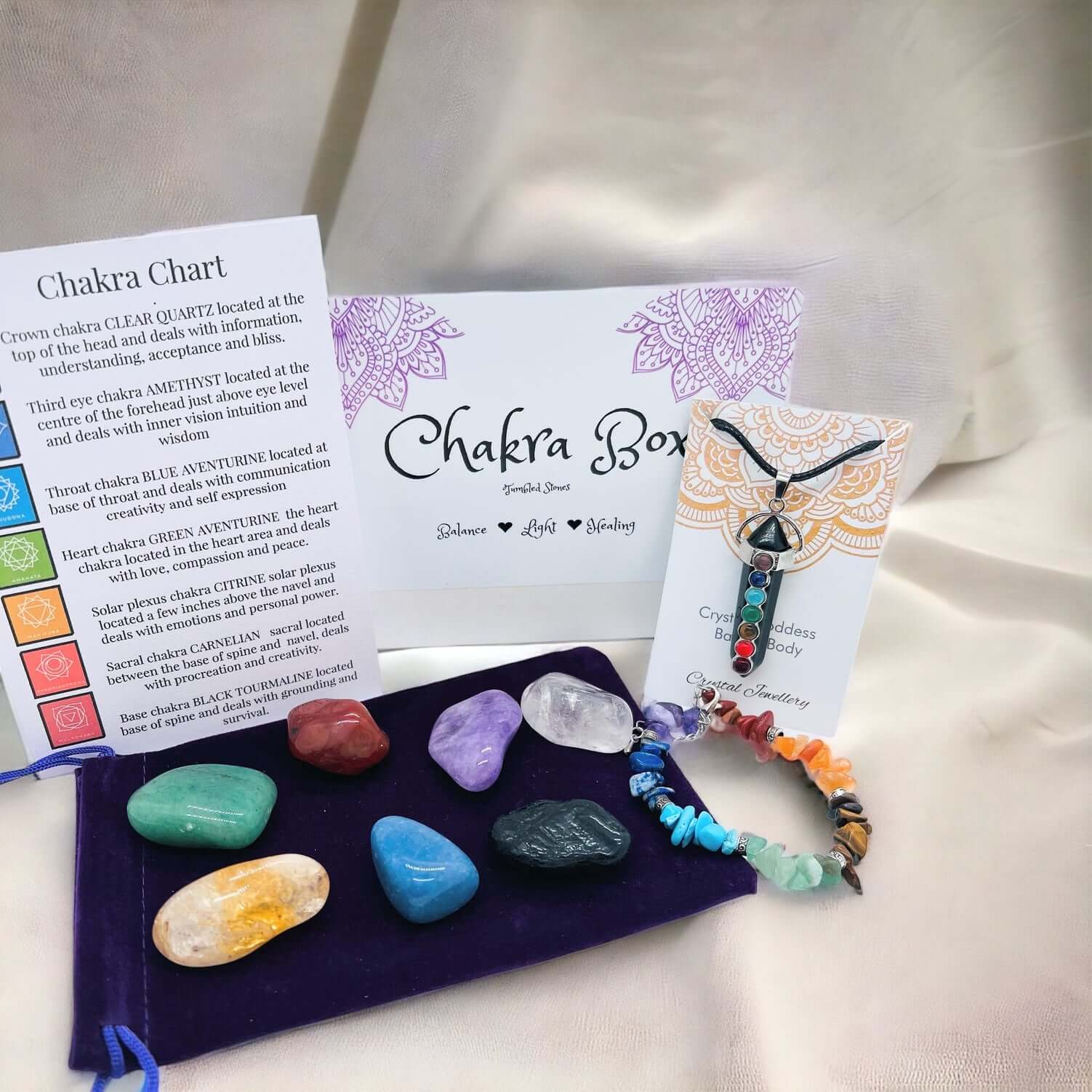 Chakra gift box containing chakra stones, chakra bracelet and chakra pendant