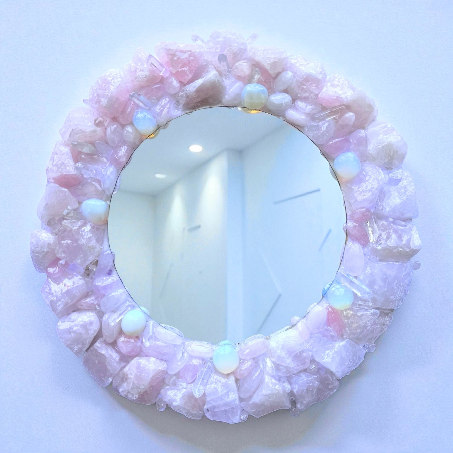 Crystal Mirror "Angel Aura" with 28cm rose quartz and opalite frame, featuring an 18cm reflective surface creating a calming ambiance.