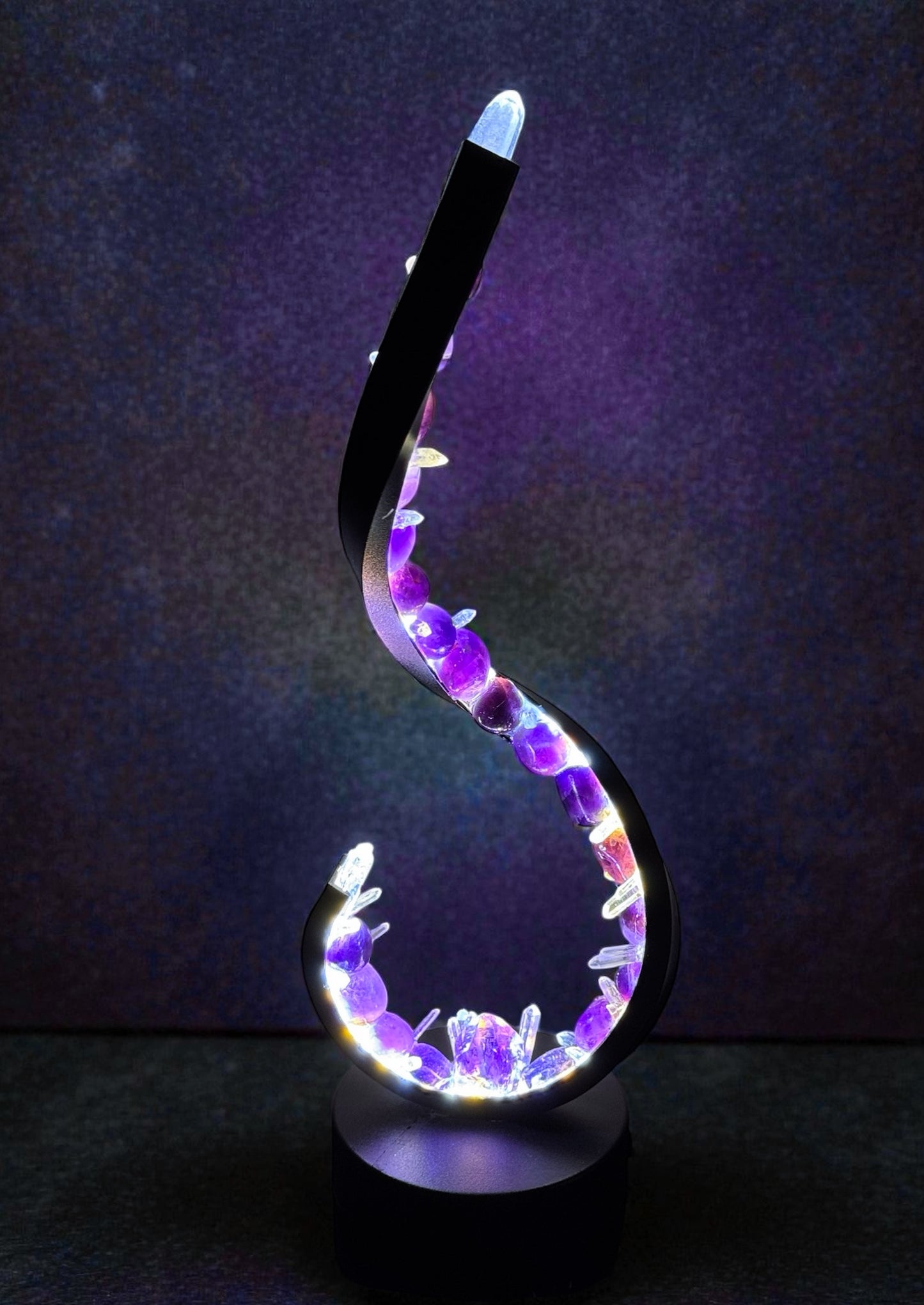 Crystal lamp with amethyst and quartz in a wave shape for balance and energy.