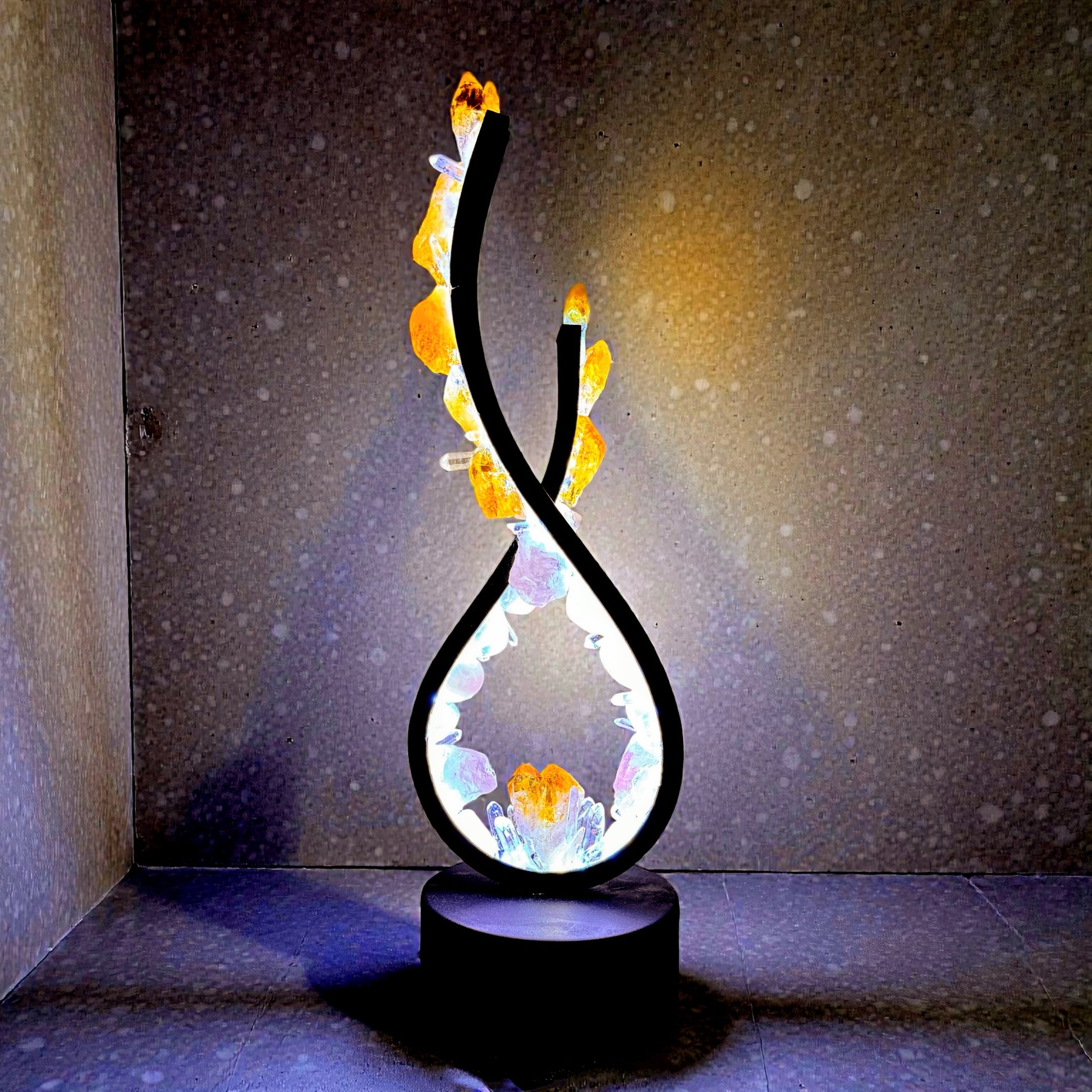 Crystal lamp "Golden Dawn" with rose quartz and citrine, flame design with clear quartz points, radiating warm and uplifting energy.