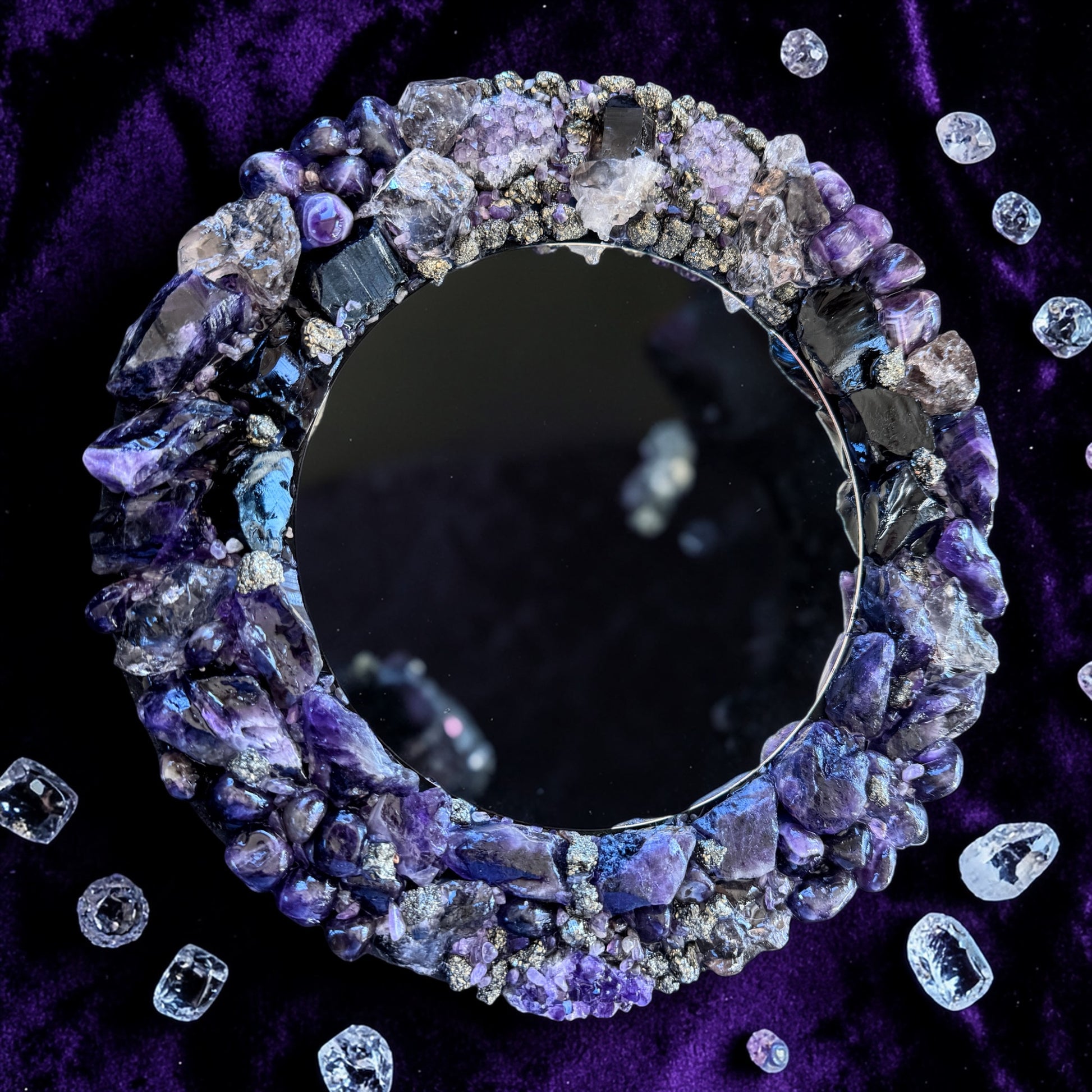 Midnight Magic Crystal Mirror 28cm with amethyst, obsidian, smoky quartz, and pyrite on a dark textured background.