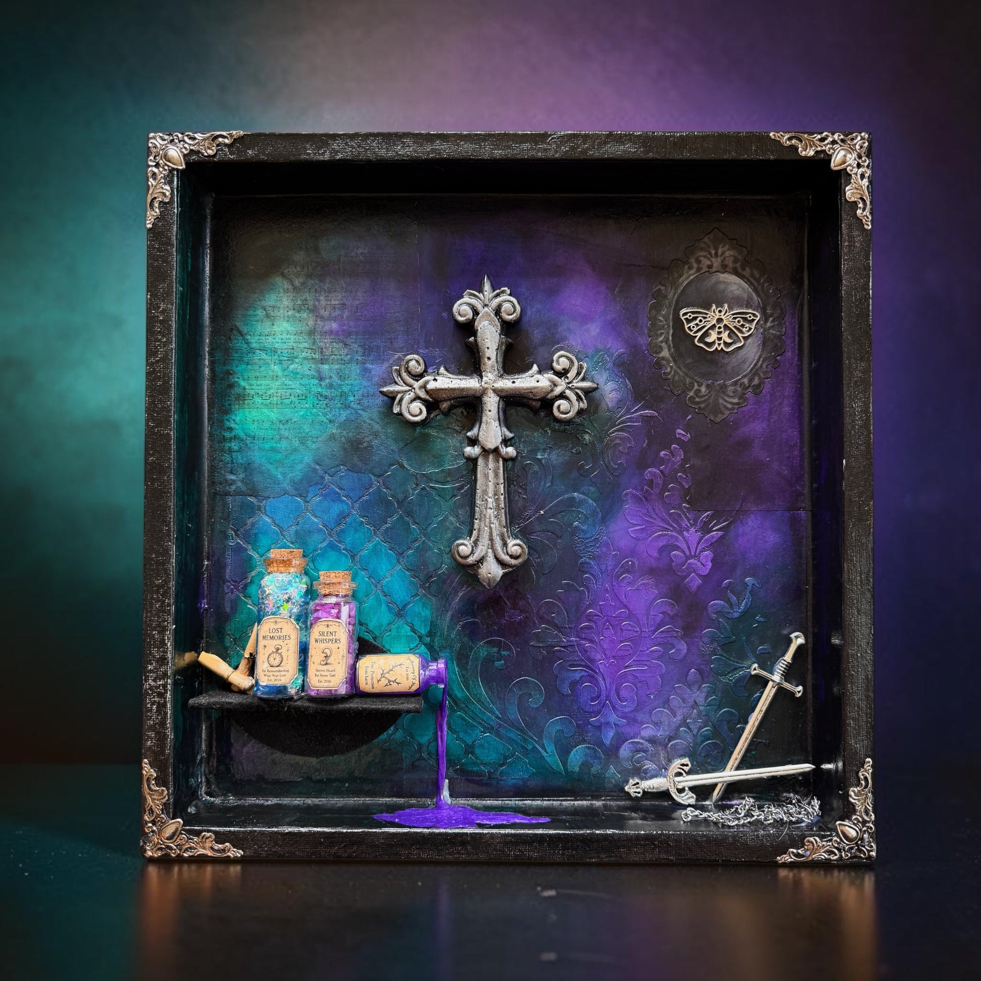 Handcrafted mixed-media shadow box featuring a gothic cross, potion bottles, and ceremonial swords in rich colors.