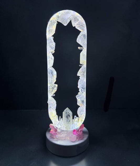 Elegant Moon Goddess Crystal Lamp showcasing clear quartz and pink aura quartz, illuminating with a soft glow.